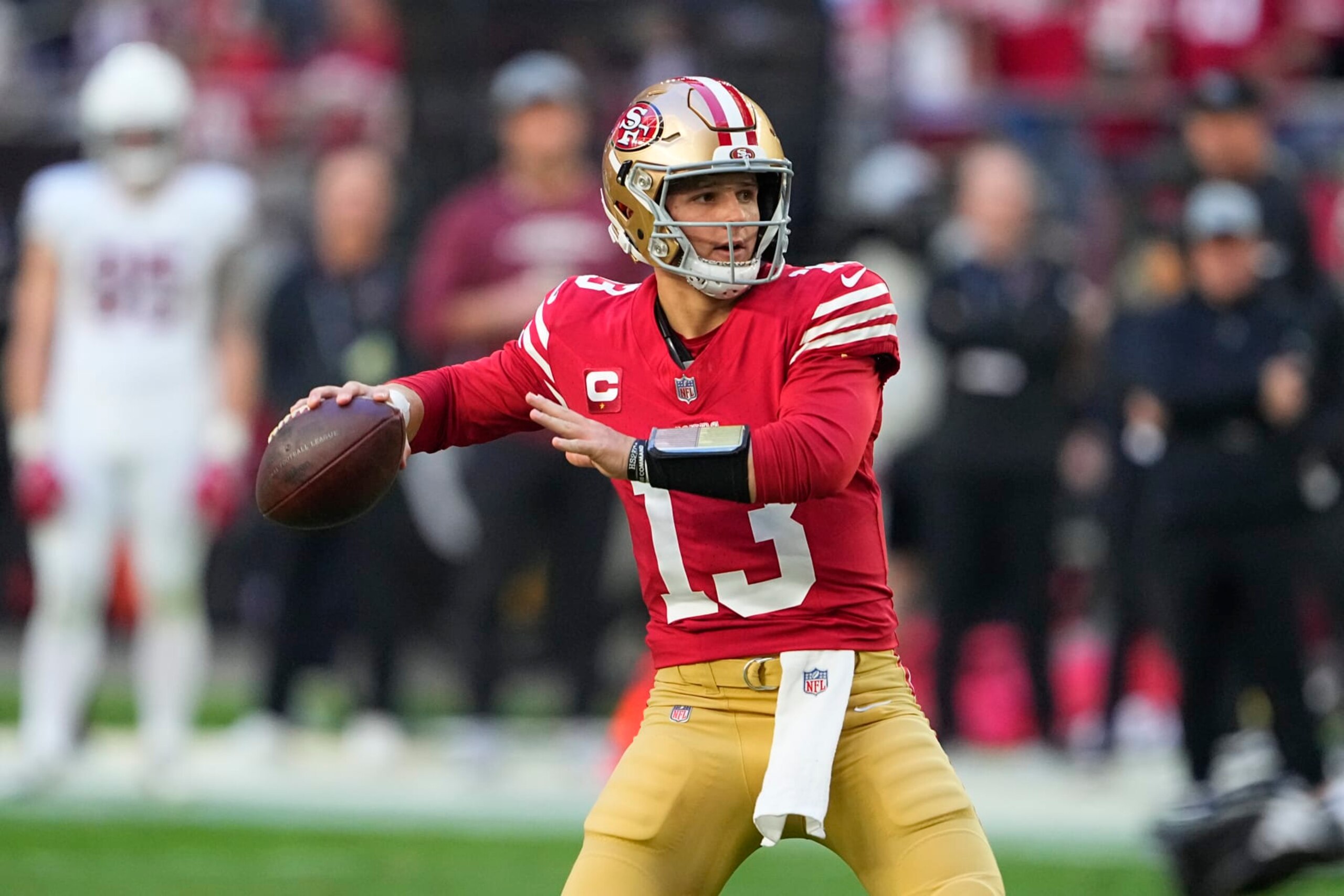 San Francisco 49ers quarterback Brock Purdy passes against the Arizona Cardinals during the first half of an NFL football game Sunday, Dec. 17, 2023, in Glendale, Ariz. (AP Photo/Matt York) San Francisco 49ers quarterback Brock Purdy passes against the Arizona Cardinals during the first half of an NFL football game Sunday, Dec. 17, 2023, in Glendale, Ariz. (AP Photo/Matt York)