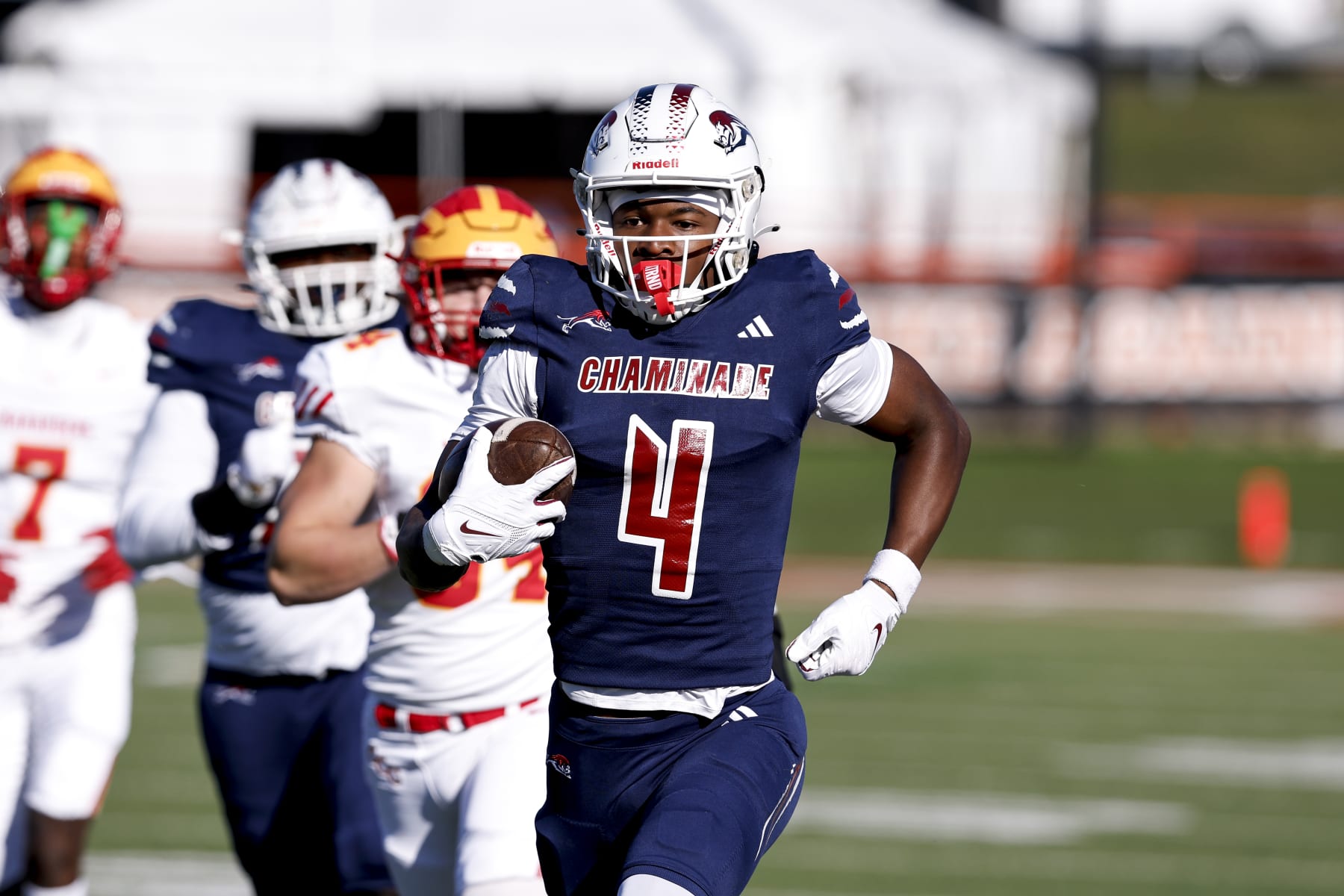 TALLAHASSEE, FLORIDA - DECEMBER 07: Wide Receiver Jeremiah Smith #4 of the Chaminade-Madonna Lions makes a catch and run for a touchdown during the FHSAA Class1M Football State Championship game against the Clearwater Central Catholic Marauders at Bragg Memorial Stadium on Ken Riley Field on the campus of Florida A&M University on December 7, 2023 in Tallahassee, Florida. Smith is a 5-star Wide Receiver recruit and the #1 collegiate prospect in the nation. He has committed to the Ohio State Buckeyes. The Lions defeated the Marauders 56 to 0. (Photo by Don Juan Moore/Getty Images)