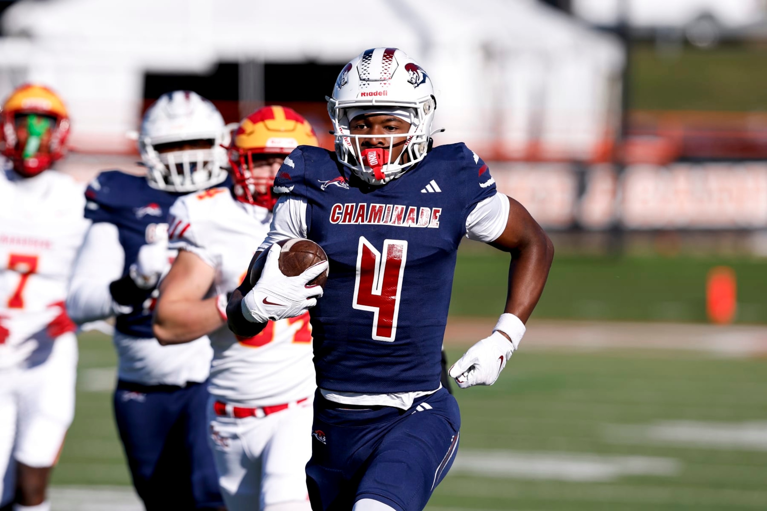 TALLAHASSEE, FLORIDA - DECEMBER 07: Wide Receiver Jeremiah Smith #4 of the Chaminade-Madonna Lions makes a catch and run for a touchdown during the FHSAA Class1M Football State Championship game against the Clearwater Central Catholic Marauders at Bragg Memorial Stadium on Ken Riley Field on the campus of Florida A&M University on December 7, 2023 in Tallahassee, Florida. Smith is a 5-star Wide Receiver recruit and the #1 collegiate prospect in the nation. He has committed to the Ohio State Buckeyes. The Lions defeated the Marauders 56 to 0. (Photo by Don Juan Moore/Getty Images)