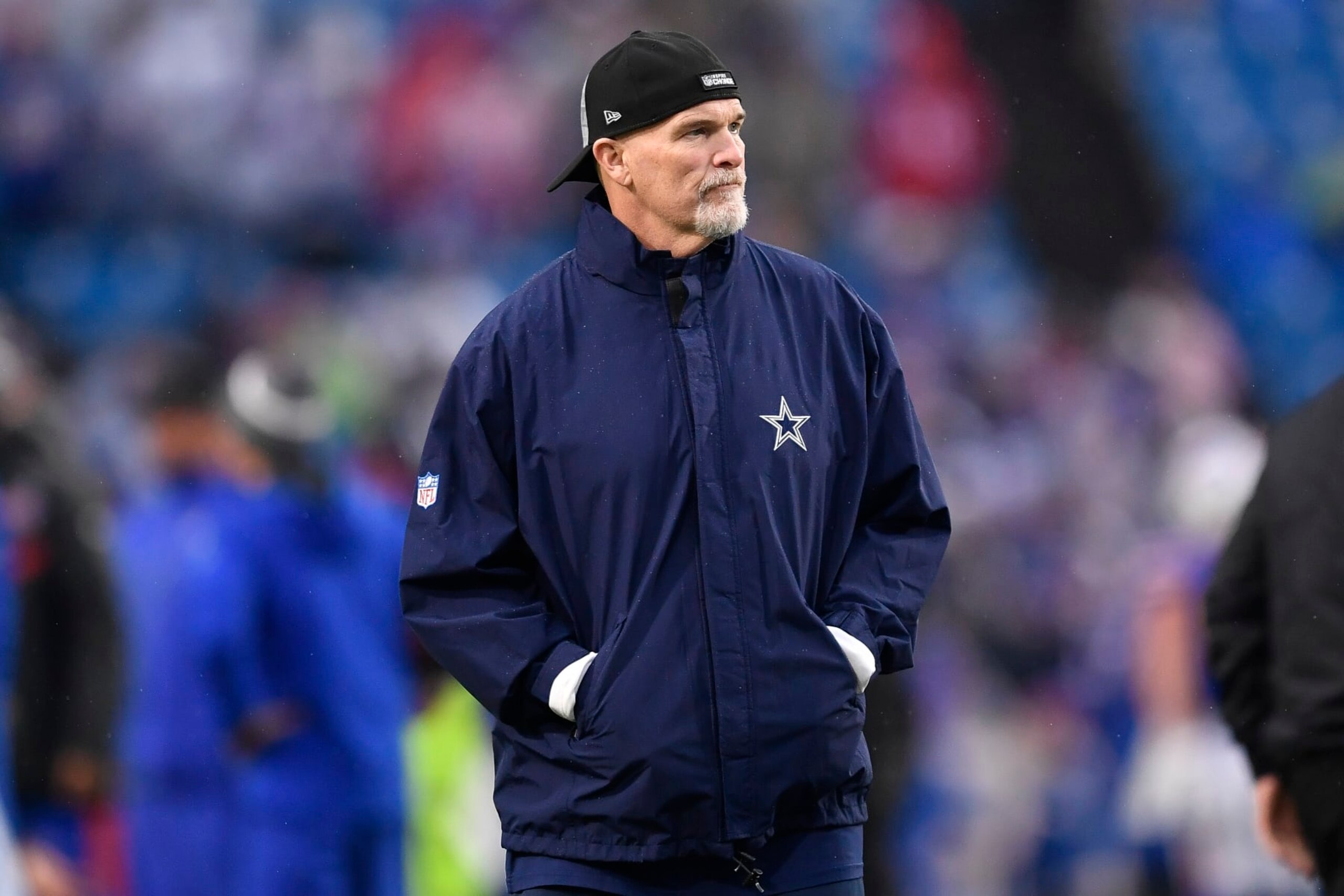 Dallas Cowboys defensive coordinator Dan Quinn watches warm ups before an NFL football game against the Buffalo Bills in Orchard Park, N.Y., Sunday, Dec. 17, 2023. (AP Photo/Adrian Kraus)