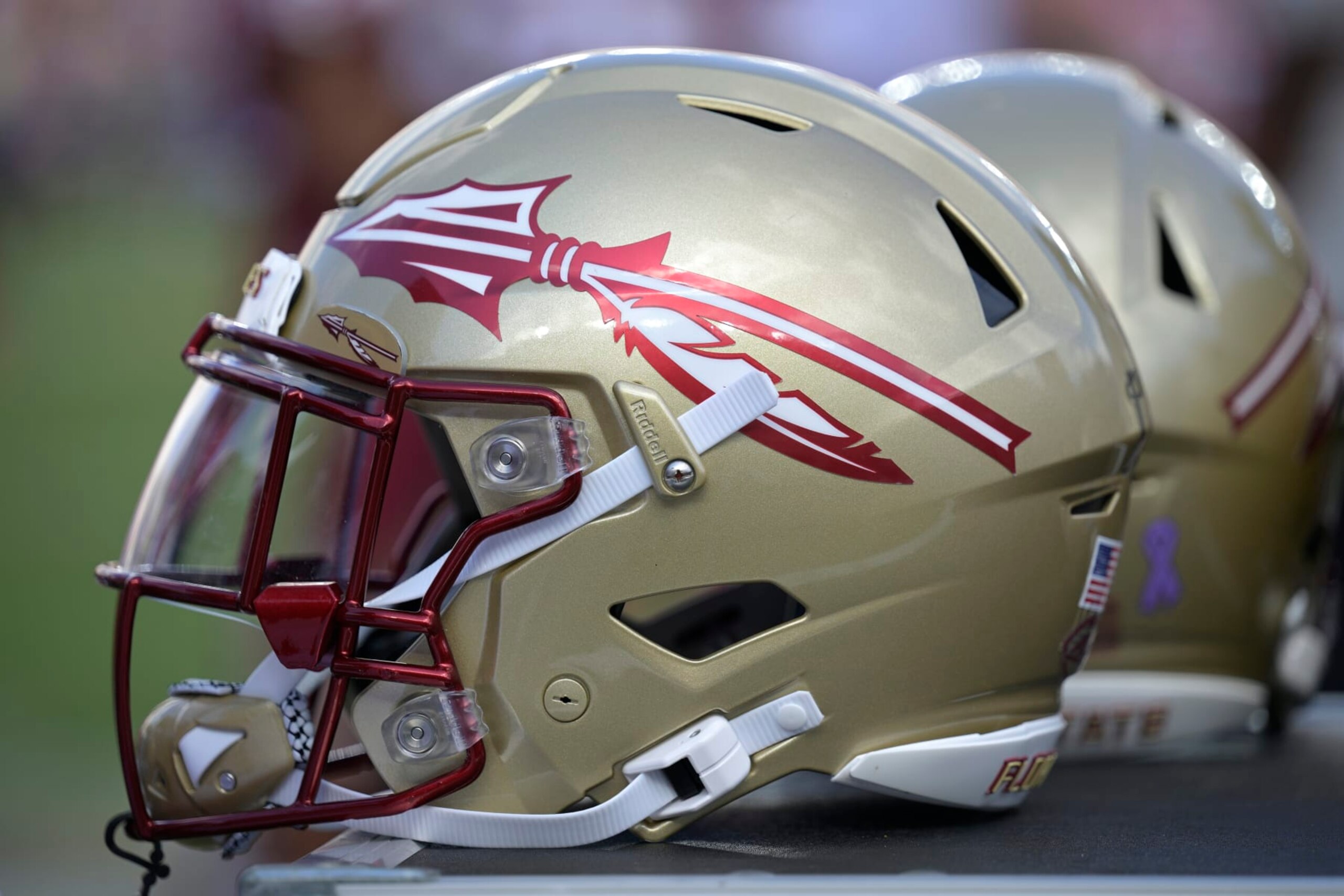 Florida State helmets are viewed on the sideline during the second half of an NCAA college football game against Syracuse, Saturday, Oct. 14, 2023, in Tallahassee, Fla. (AP Photo/Phelan M. Ebenhack)