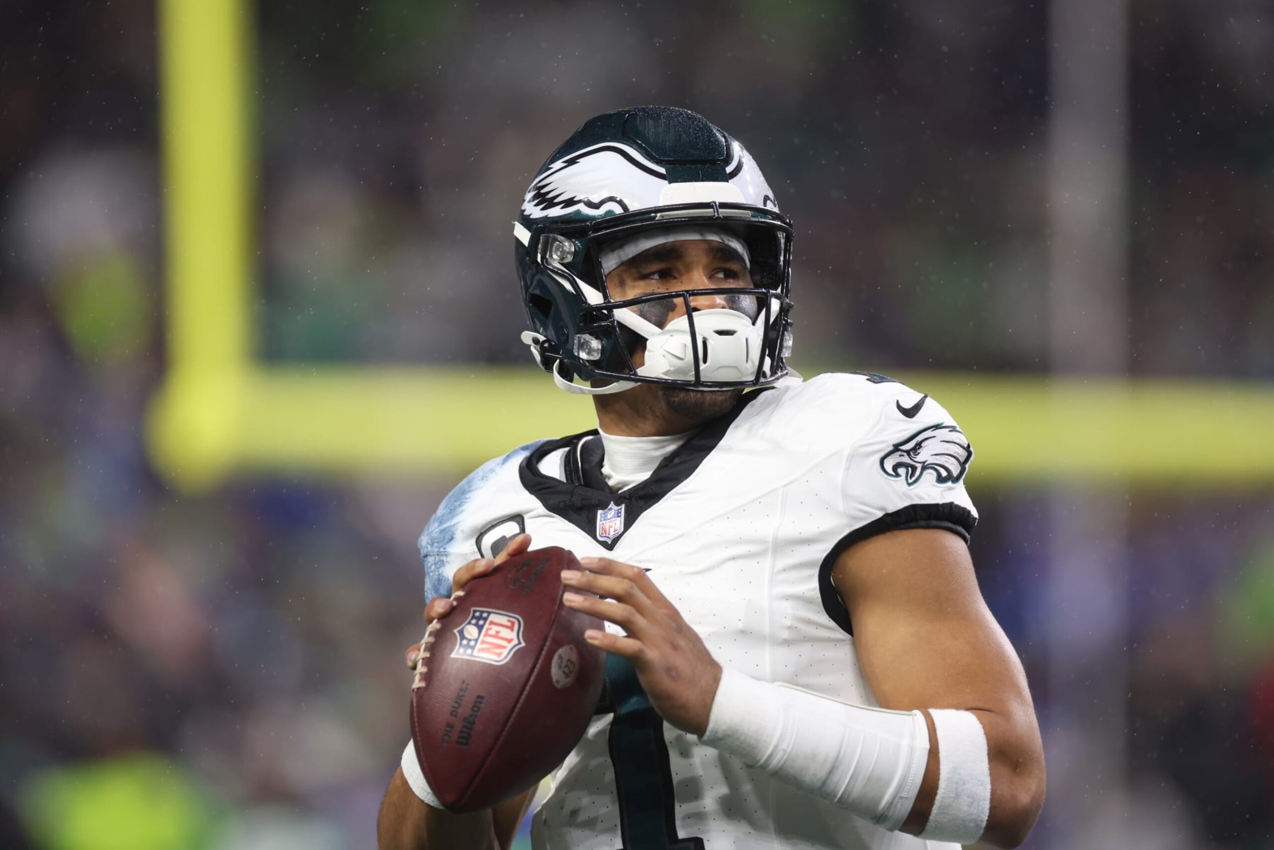 SEATTLE, WASHINGTON - DECEMBER 18: Jalen Hurts #1 of the Philadelphia Eagles looks on in the first half at Lumen Field on December 18, 2023 in Seattle, Washington. (Photo by Steph Chambers/Getty Images)