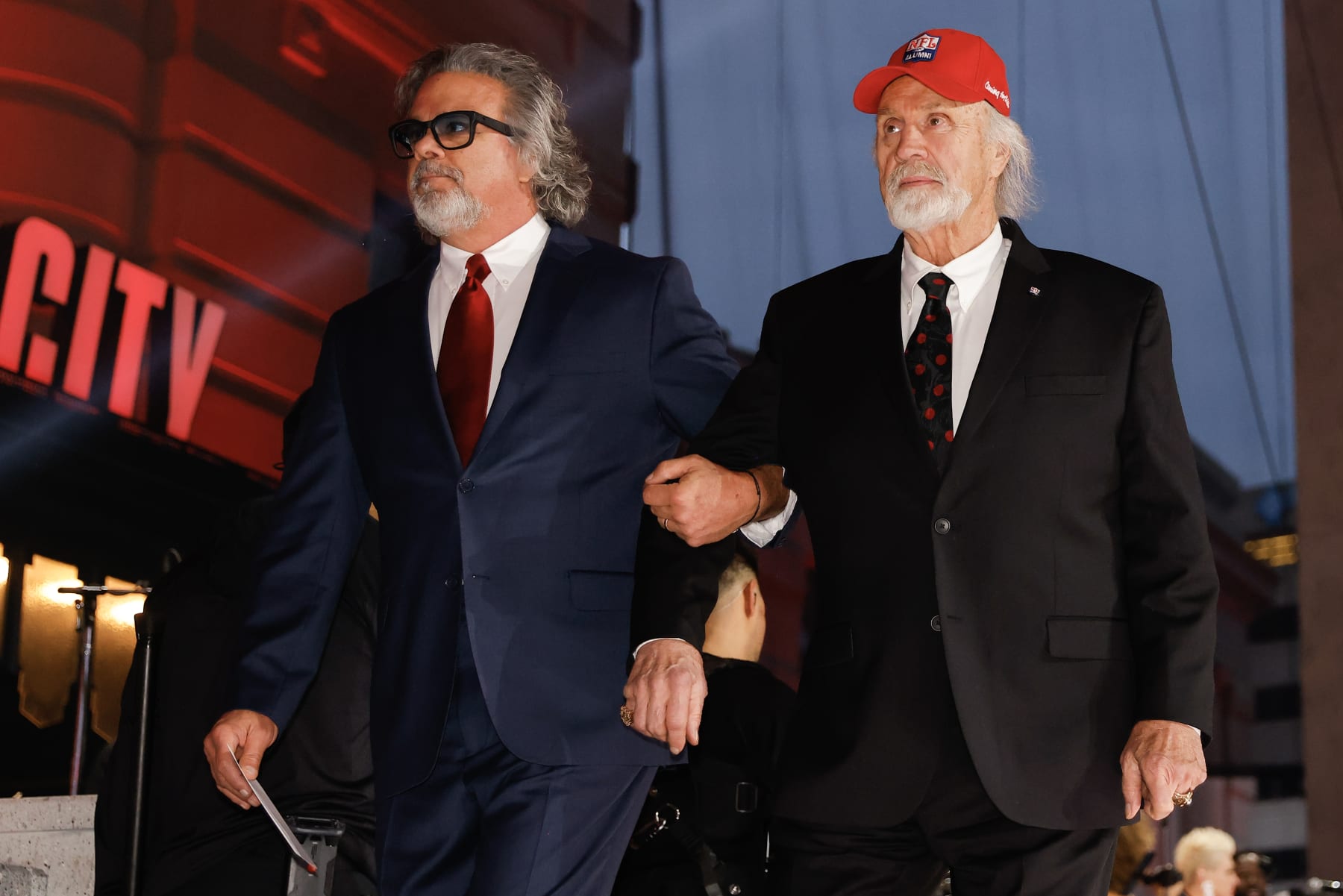 KANSAS CITY, MO - APRIL 28: Brad Budde (L) and his father, Ed Budde, both former players with the Kansas City Chiefs, walk onto the stage during the second round of the 2023 NFL Draft at Union Station on April 28, 2023 in Kansas City, Missouri. (Photo by David Eulitt/Getty Images)