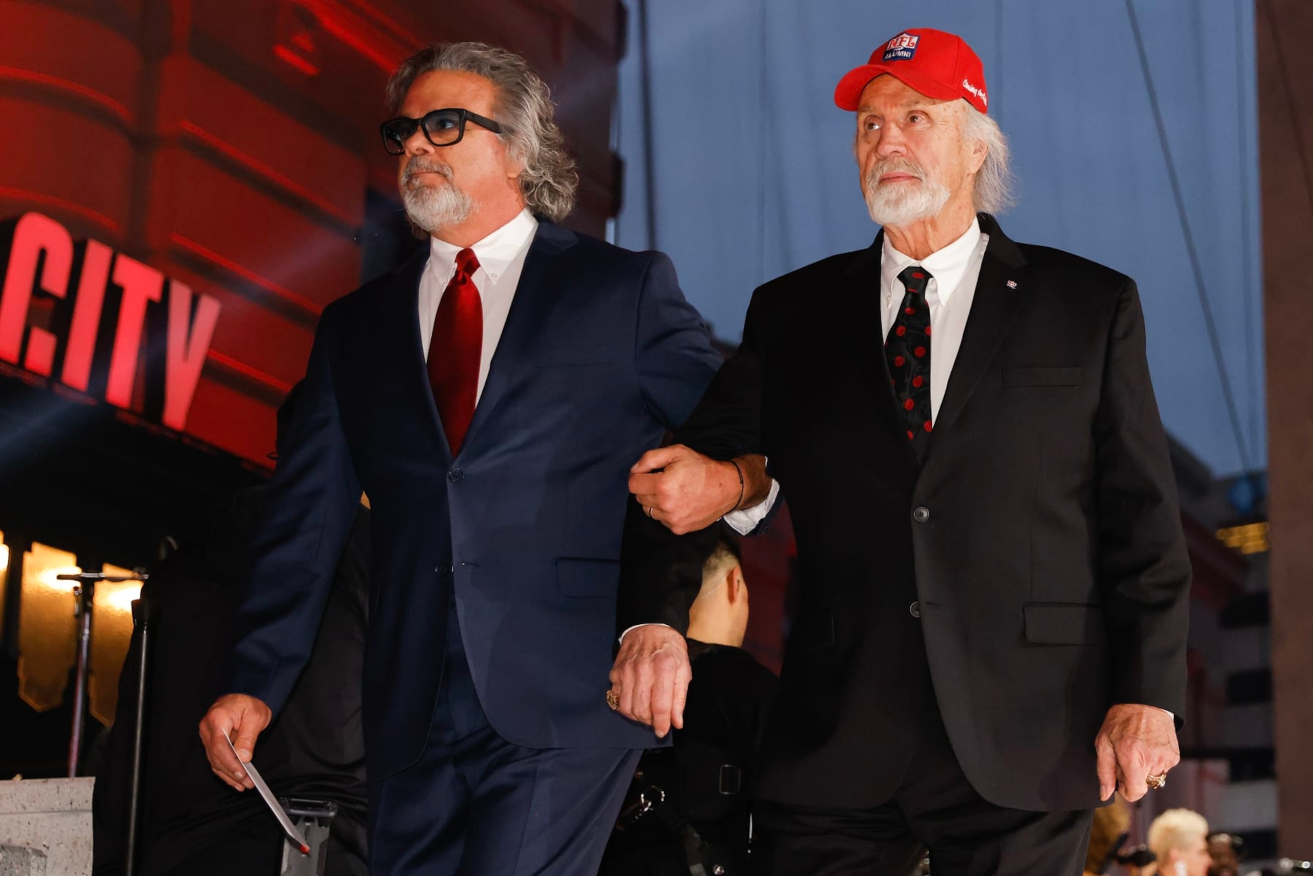 KANSAS CITY, MO - APRIL 28: Brad Budde (L) and his father, Ed Budde, both former players with the Kansas City Chiefs, walk onto the stage during the second round of the 2023 NFL Draft at Union Station on April 28, 2023 in Kansas City, Missouri. (Photo by David Eulitt/Getty Images)