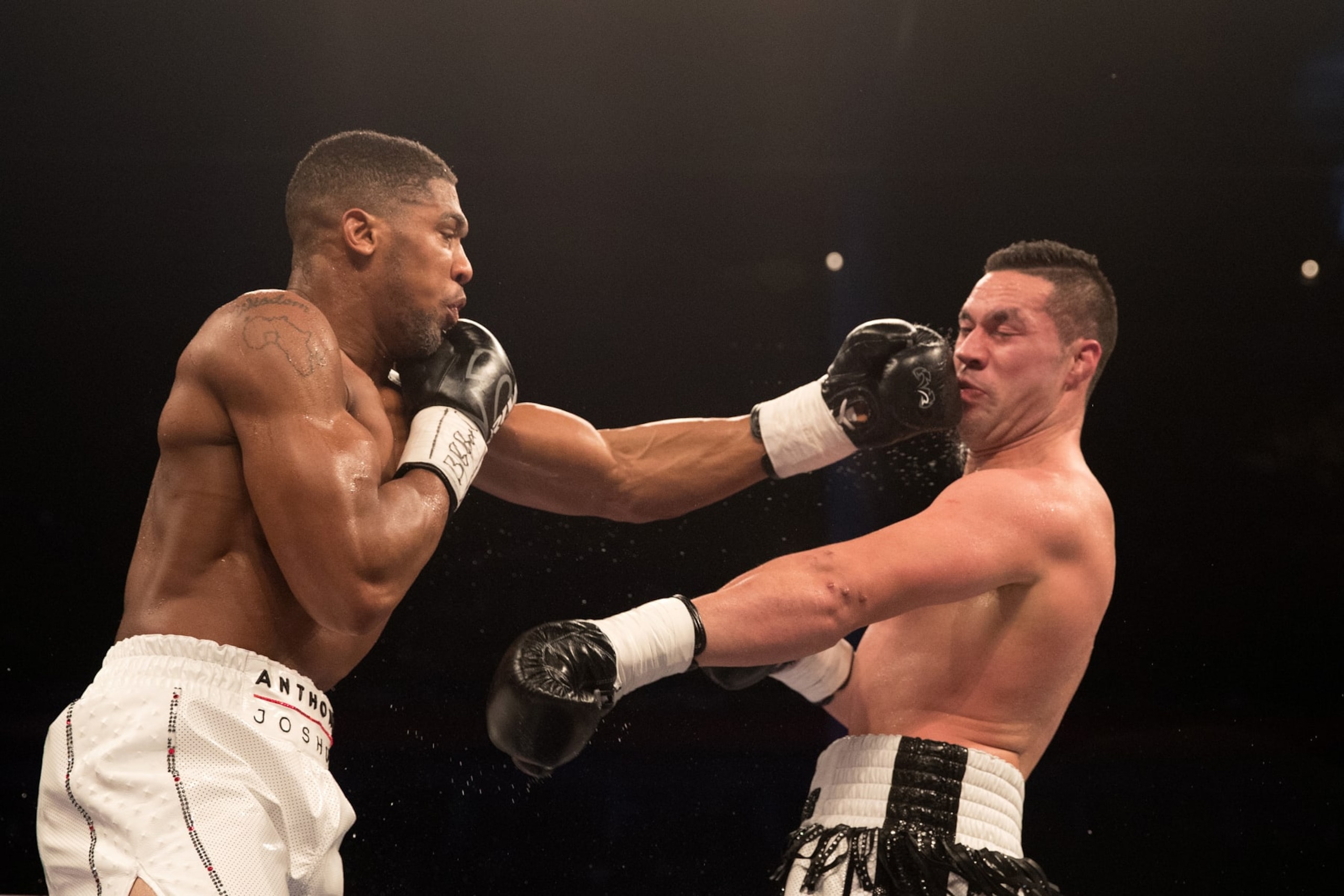 CARDIFF, WALES - MARCH 31:  Anthony Joshua and Joseph Parker trade punches during their WBA, IBF, WBO & IBO Heavyweight Championship title fight at Principality Stadium on March 31, 2018 in Cardiff, Wales.  (Photo by Richard Heathcote/Getty Images)