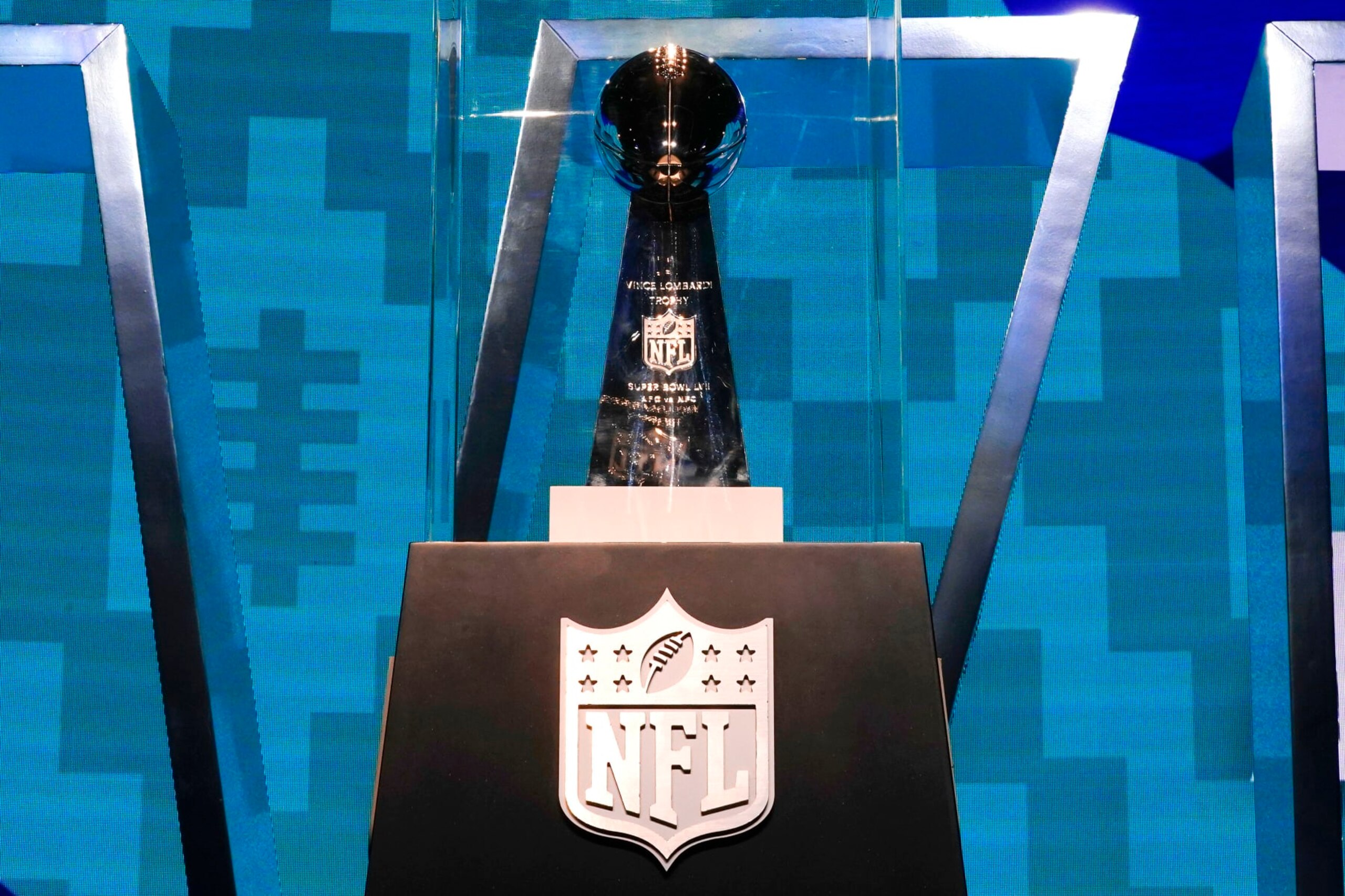 The Vince Lombardi Trophy stands on display at the Super Bowl Experience, open to fans for the first day, leading up to the NFL Super Bowl LVII football game in Phoenix, Saturday, Feb. 4, 2023. (AP Photo/Ross D. Franklin)
