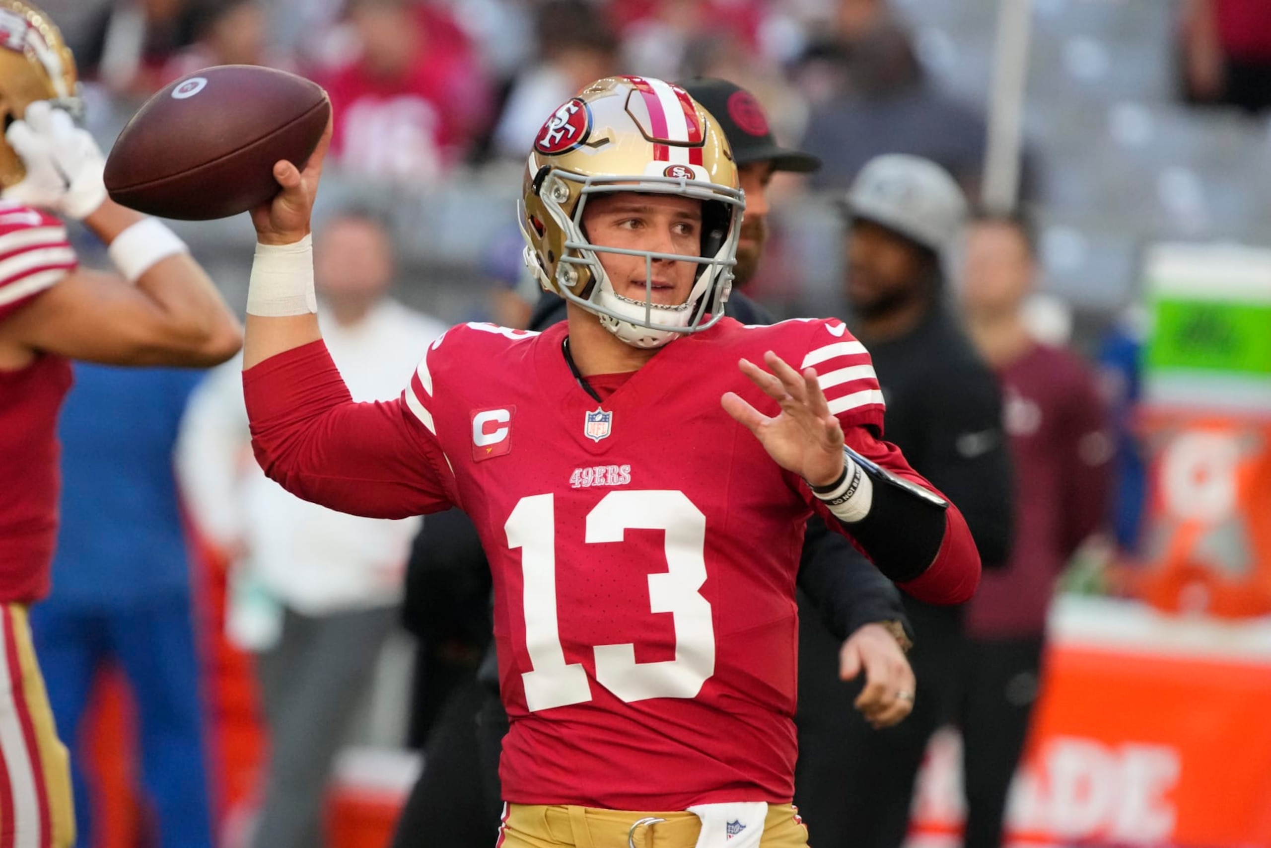 San Francisco 49ers quarterback Brock Purdy (13) warms up before an NFL football game against the Arizona Cardinals, Sunday, Dec. 17, 2023, in Glendale, Ariz. (AP Photo/Rick Scuteri)