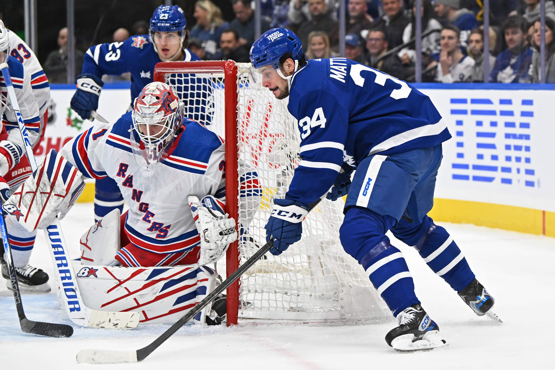 TORONTO, ON - DECEMBER 19: Toronto Maple Leafs Center Auston Matthews (34) attempts a wrap around shot on New York Rangers Goalie Igor Shesterkin (31) in the first period during the regular season NHL game between the New York Rangers and Toronto Maple Leafs on December 19, 2023 at Scotiabank Arena in Toronto, ON. (Photo by Gerry Angus/Icon Sportswire via Getty Images)