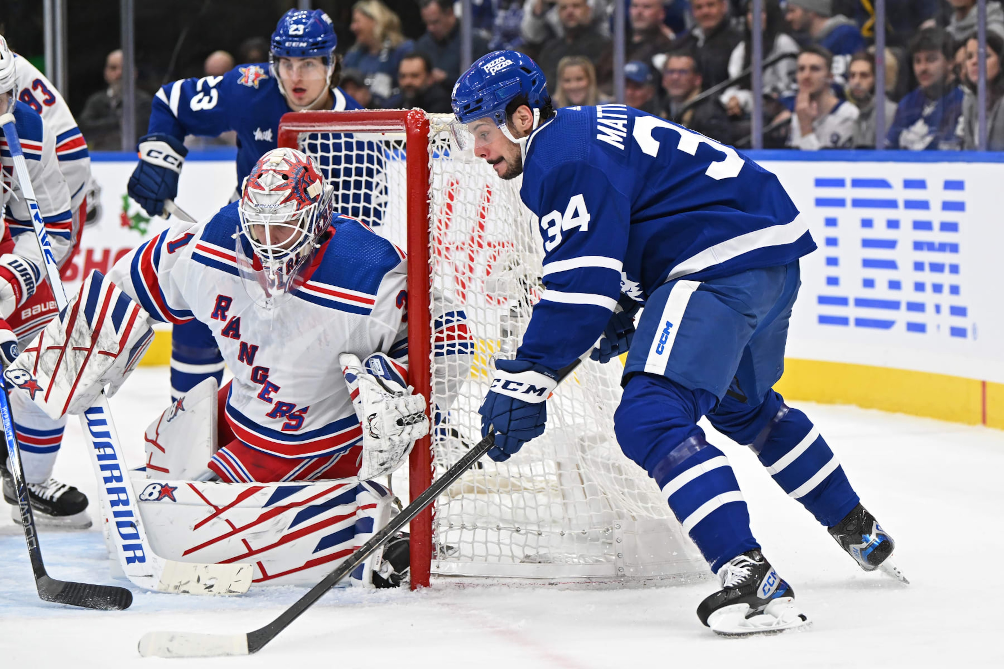 TORONTO, ON - DECEMBER 19: Toronto Maple Leafs Center Auston Matthews (34) attempts a wrap around shot on New York Rangers Goalie Igor Shesterkin (31) in the first period during the regular season NHL game between the New York Rangers and Toronto Maple Leafs on December 19, 2023 at Scotiabank Arena in Toronto, ON. (Photo by Gerry Angus/Icon Sportswire via Getty Images) TORONTO, ON - DECEMBER 19: Toronto Maple Leafs Center Auston Matthews (34) attempts a wrap around shot on New York Rangers Goalie Igor Shesterkin (31) in the first period during the regular season NHL game between the New York Rangers and Toronto Maple Leafs on December 19, 2023 at Scotiabank Arena in Toronto, ON. (Photo by Gerry Angus/Icon Sportswire via Getty Images)