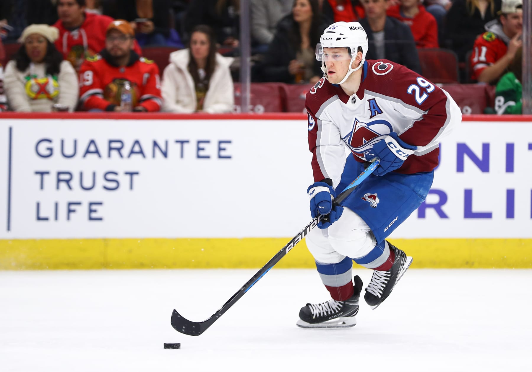 CHICAGO, IL - DECEMBER 19: Nathan MacKinnon #29 of the Colorado Avalanche brings the puck up ice during the first period against the Chicago Blackhawks at the United Center on December, 19, 2023 in Chicago, Illinois. (Photo by Melissa Tamez/Icon Sportswire via Getty Images)