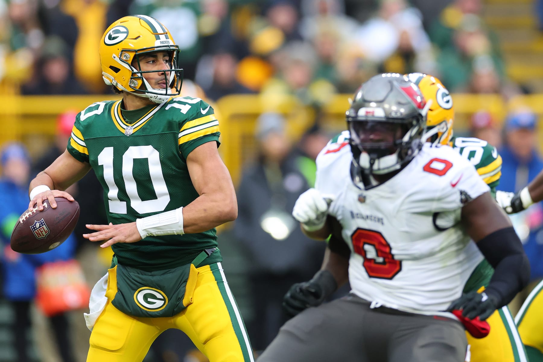 GREEN BAY, WISCONSIN - DECEMBER 17: Jordan Love #10 of the Green Bay Packers looks to pass during a game against the Tampa Bay Buccaneers at Lambeau Field on December 17, 2023 in Green Bay, Wisconsin.  The Buccaneers defeated the Packers 34-20.   (Photo by Stacy Revere/Getty Images)
