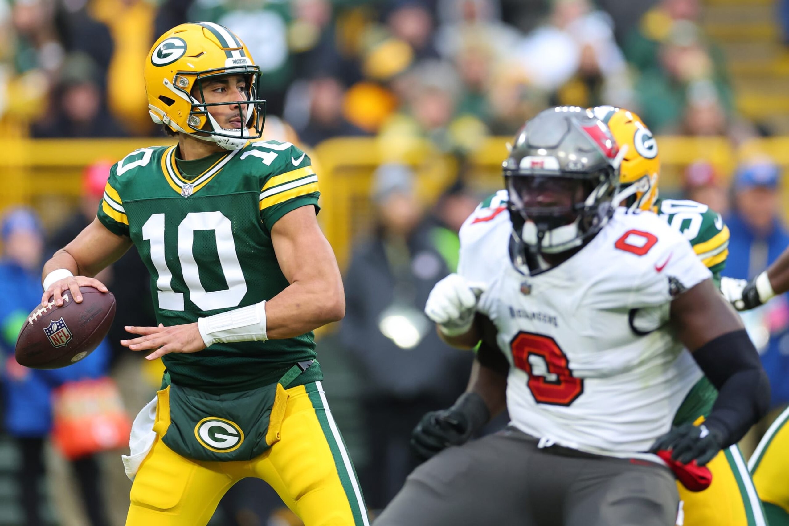 GREEN BAY, WISCONSIN - DECEMBER 17: Jordan Love #10 of the Green Bay Packers looks to pass during a game against the Tampa Bay Buccaneers at Lambeau Field on December 17, 2023 in Green Bay, Wisconsin.  The Buccaneers defeated the Packers 34-20.   (Photo by Stacy Revere/Getty Images)