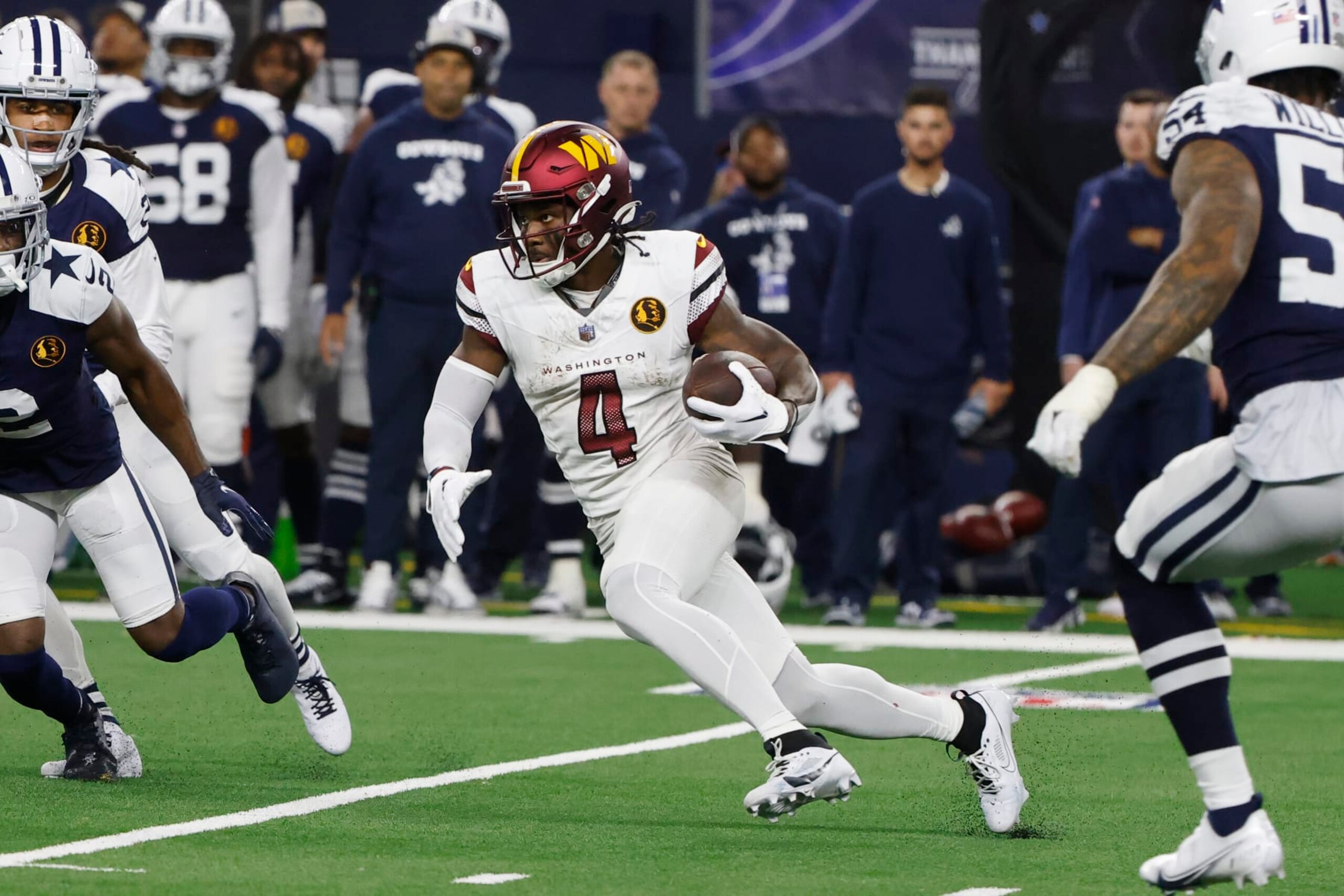 Washington Commanders wide receiver Curtis Samuel (4) runs after a reception during an NFL Football game in Arlington, Texas, Sunday, Nov. 23, 2023. (AP Photo/Michael Ainsworth)