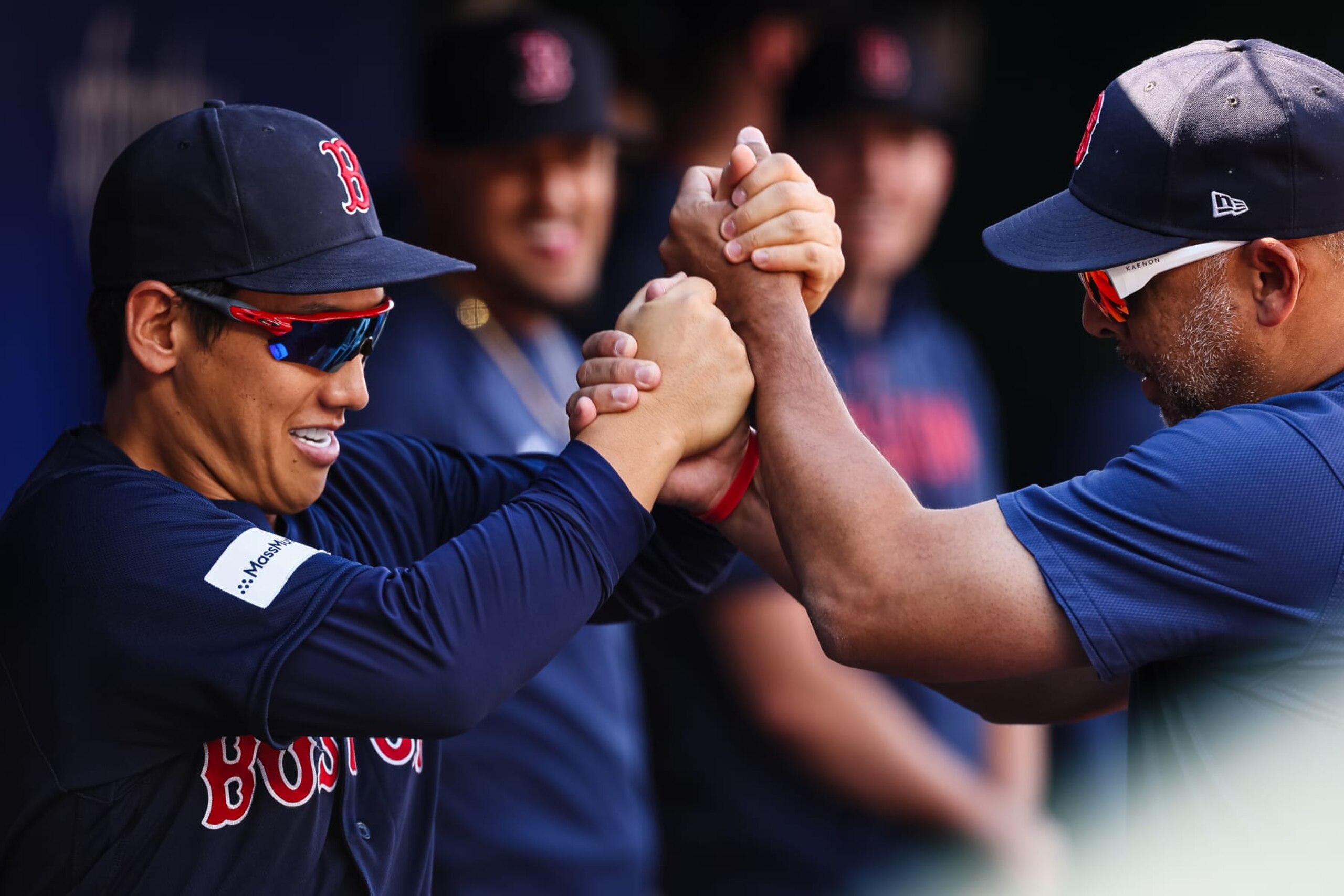 Masataka Yoshida (L) and Alex Cora (R)