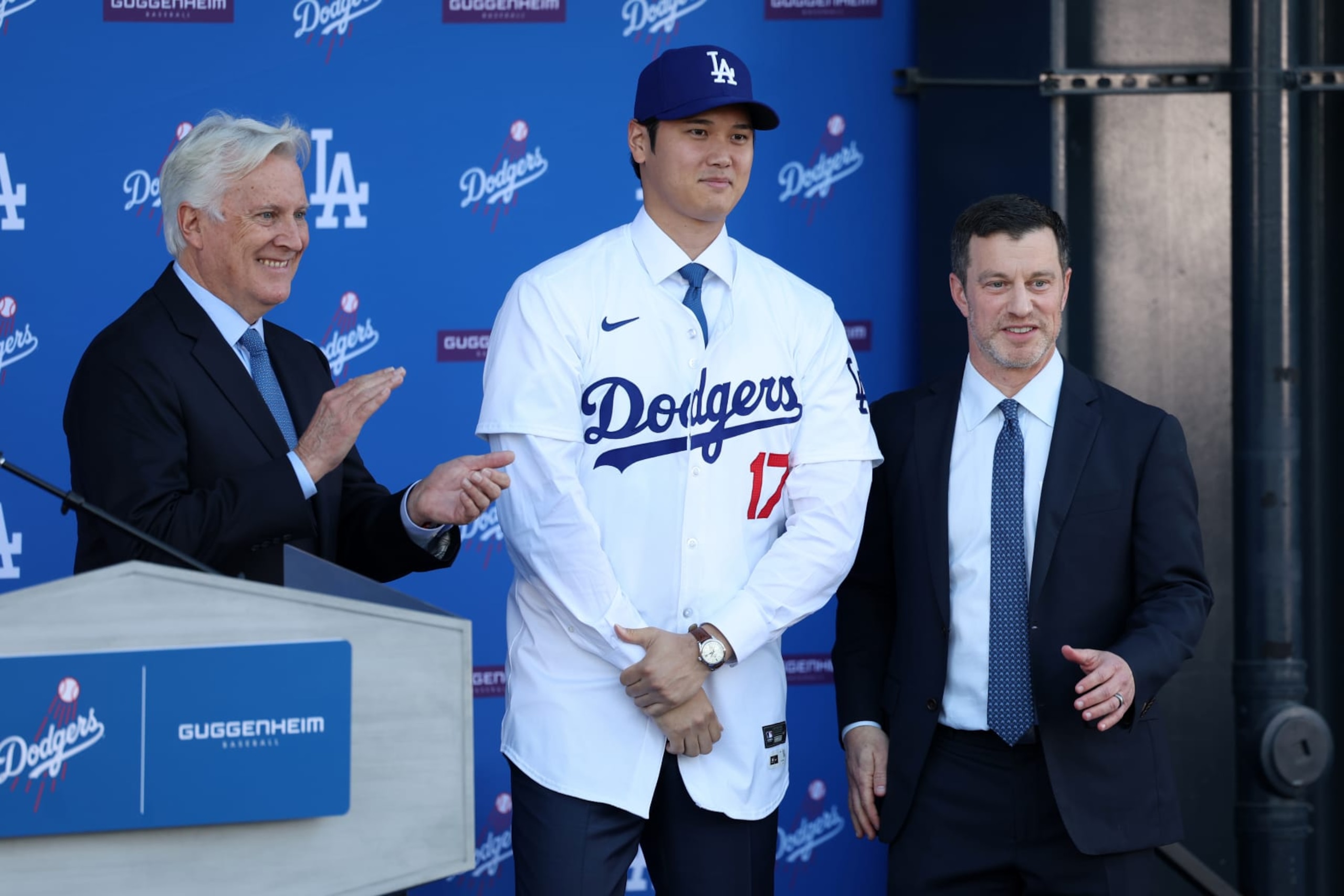 Mark Walter (L), Shohei Ohtani (C) and Andrew Friedman (R)