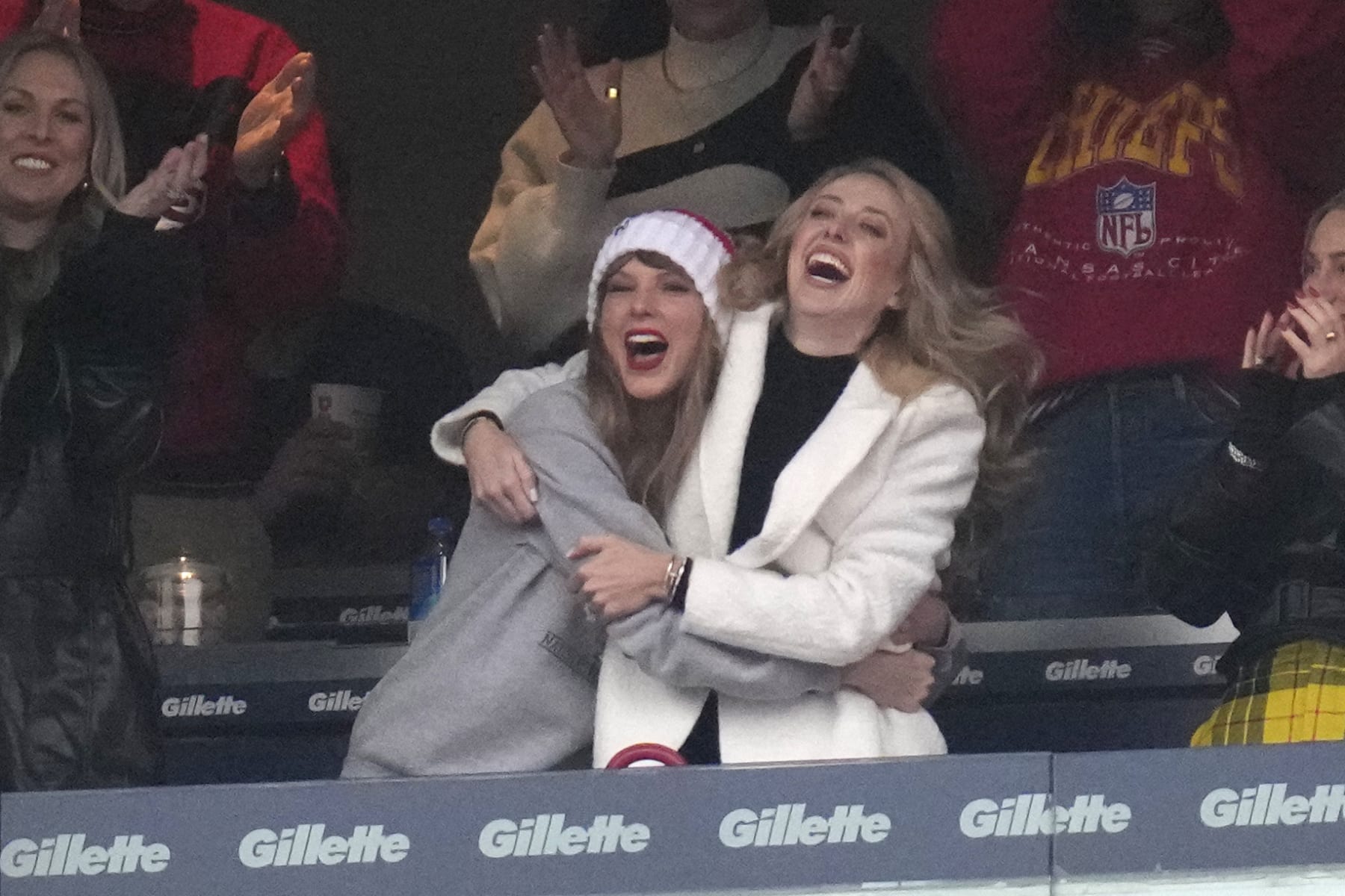 Taylor Swift, center left, reacts with Brittany Mahomes during the first half of an NFL football game against the New England Patriots, Sunday, Dec. 17, 2023, in Foxborough, Mass. (AP Photo/Charles Krupa)