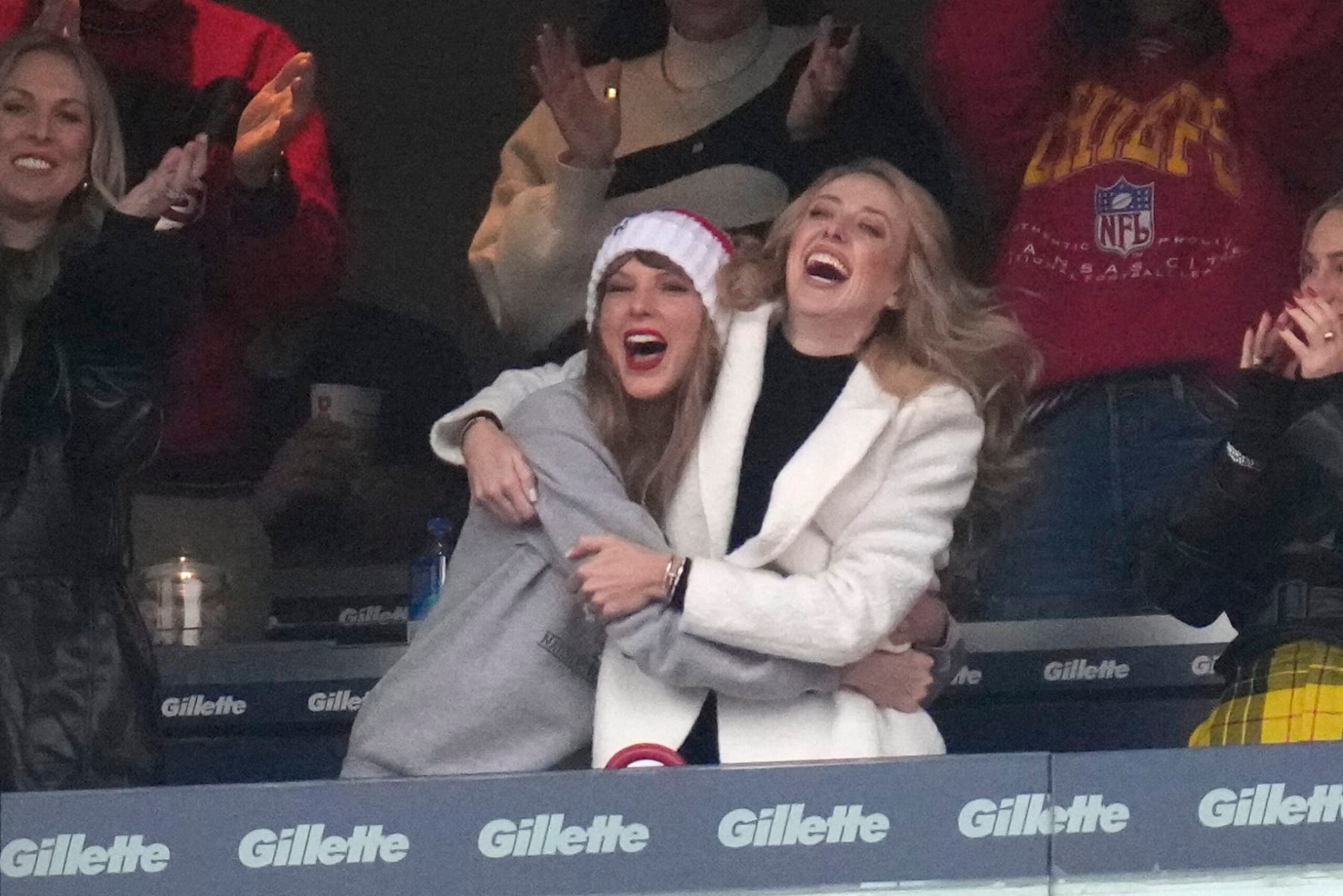 Taylor Swift, center left, reacts with Brittany Mahomes during the first half of an NFL football game against the New England Patriots, Sunday, Dec. 17, 2023, in Foxborough, Mass. (AP Photo/Charles Krupa)