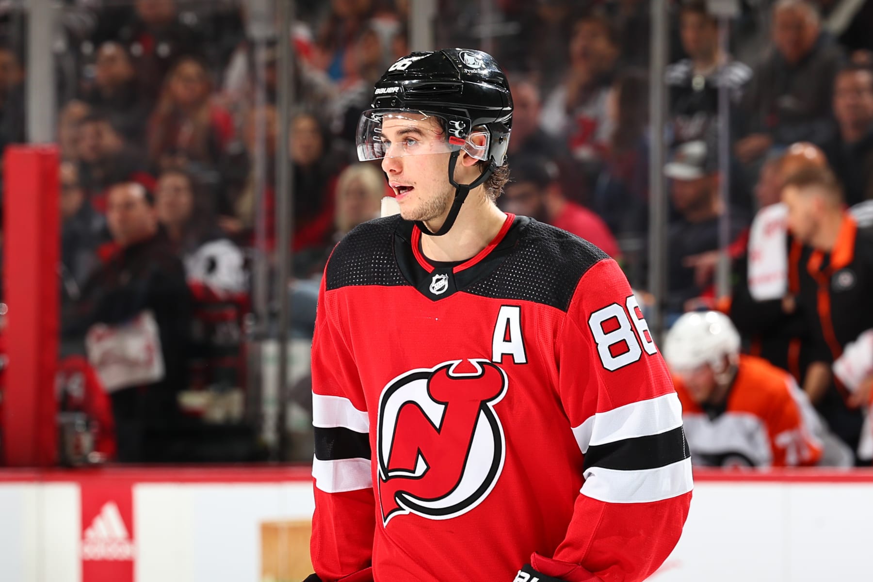 NEWARK, NJ - DECEMBER 19: Jack Hughes #86 of the New Jersey Devils skates in the first period of the game against the Philadelphia Flyers at the Prudential Center on December 19, 2023 in Newark, New Jersey.  (Photo by Rich Graessle/NHLI via Getty Images)