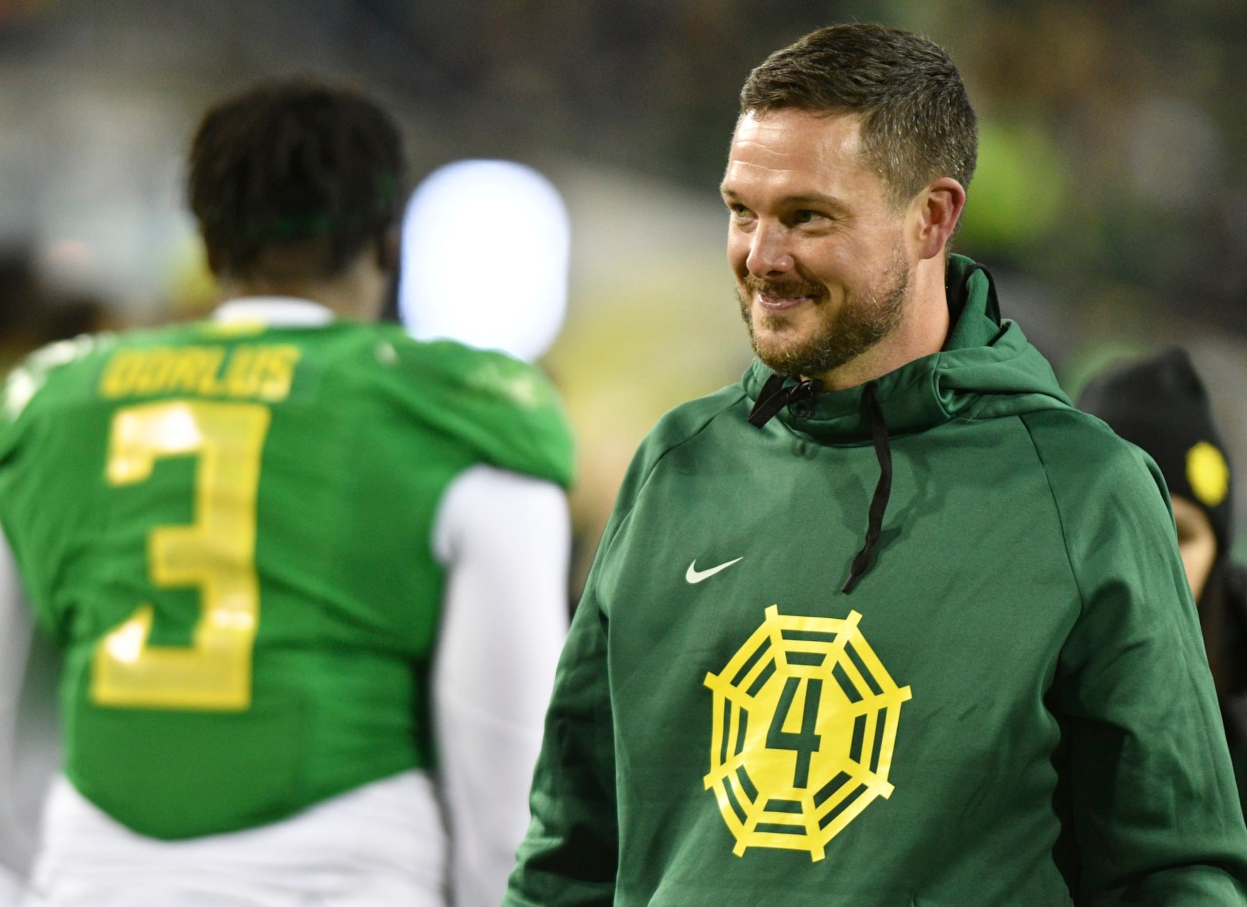 Oregon head coach Dan Lanning wears a sweatshirt in remembrance of tight end Spencer Webb who would have been a senior during pregame activities of an NCAA college football game Saturday, Nov. 24, 2023, in Eugene, Ore. Webb died in a swimming accident in July of 2022. Oregon won 31-7. (AP Photo/Mark Ylen)