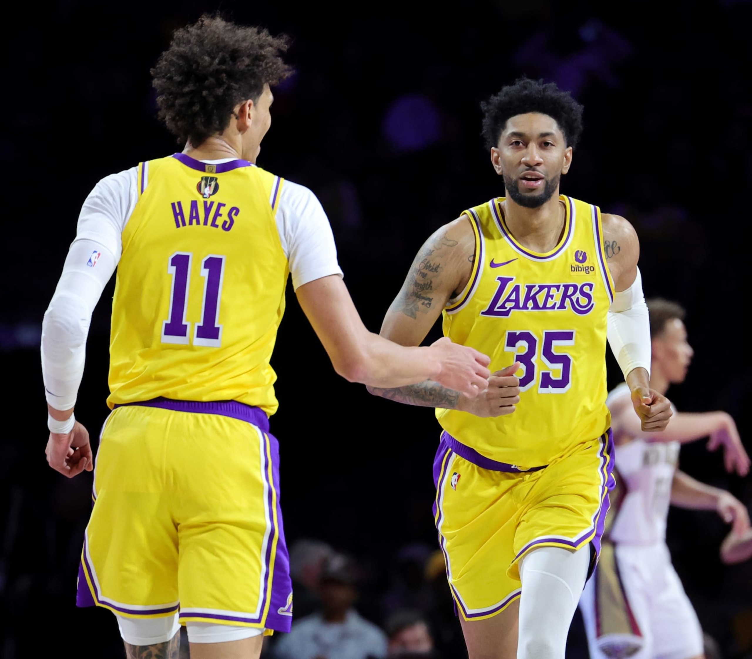 LAS VEGAS, NEVADA - DECEMBER 07: Jaxson Hayes #11 of the Los Angeles Lakers congratulates Christian Wood #35 after he scored against the New Orleans Pelicans in the second half of the West semifinal game of the inaugural NBA In-Season Tournament at T-Mobile Arena on December 07, 2023 in Las Vegas, Nevada. The Lakers defeated the Pelicans 133-89. NOTE TO USER: User expressly acknowledges and agrees that, by downloading and or using this photograph, User is consenting to the terms and conditions of the Getty Images License Agreement.  (Photo by Ethan Miller/Getty Images)