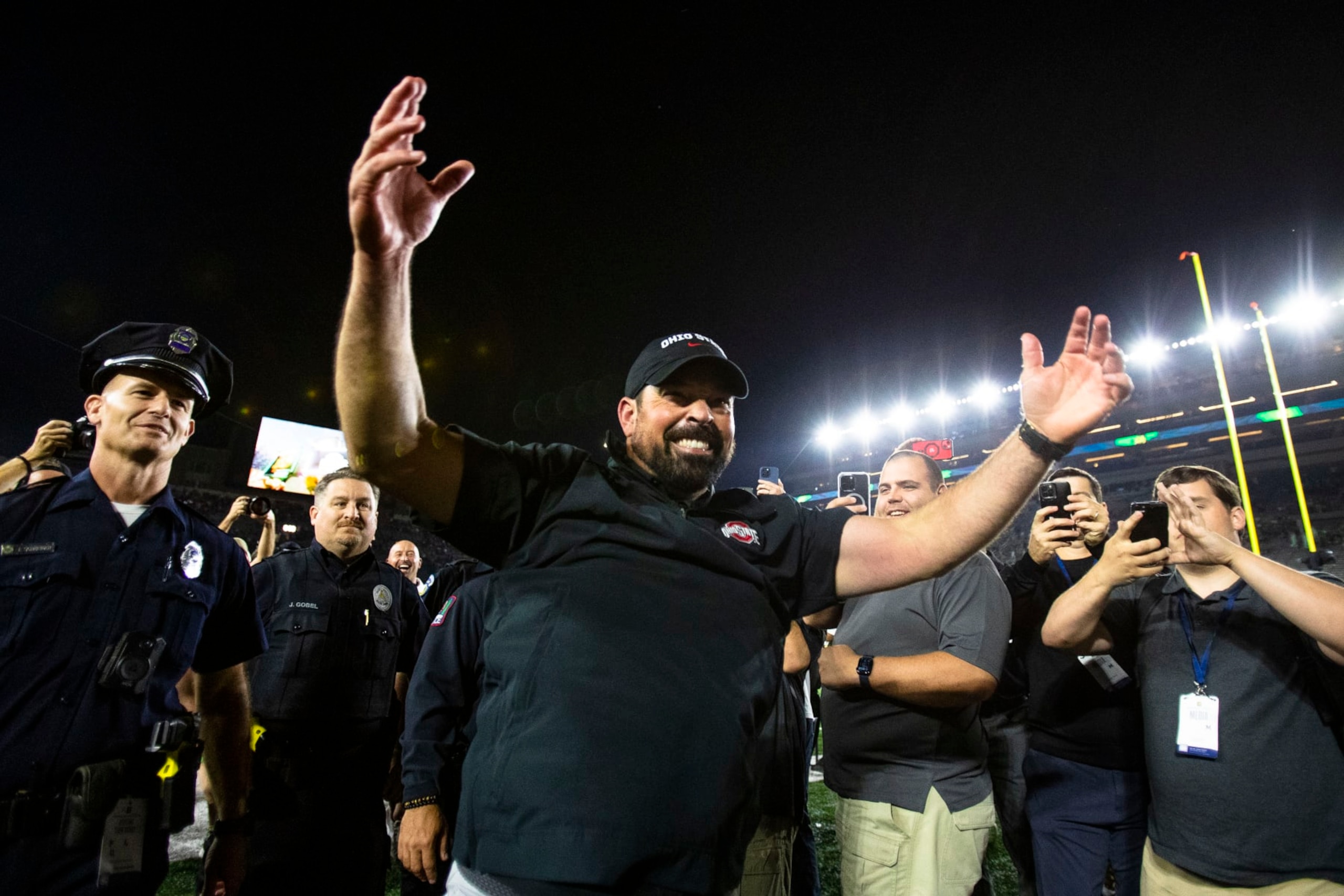 Ohio State coach Ryan Day celebrates as he walks off the filed after the team's win over Notre Dame in an NCAA college football game on Saturday, Sept. 23, 2023, in South Bend, Ind. (AP Photo/Michael Caterina)