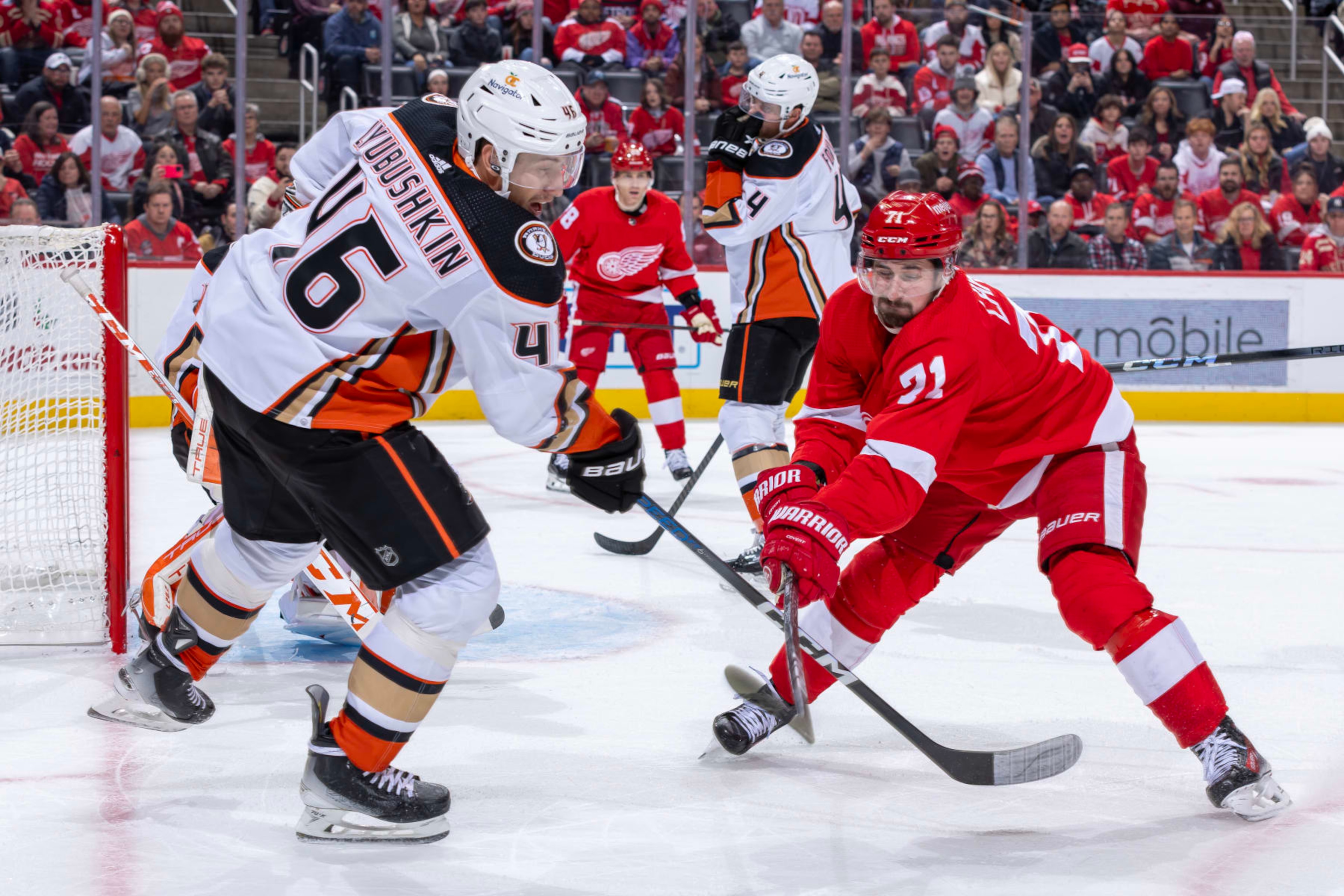 DETROIT, MI - DECEMBER 18: Dylan Larkin #71 of the Detroit Red Wings chops the stick of Ilya Lyubushkin #46 of the Anaheim Ducks during the third period at Little Caesars Arena on December 18, 2023 in Detroit, Michigan. Anaheim defeated Anaheim 4-3. (Photo by Dave Reginek/NHLI via Getty Images) DETROIT, MI - DECEMBER 18: Dylan Larkin #71 of the Detroit Red Wings chops the stick of Ilya Lyubushkin #46 of the Anaheim Ducks during the third period at Little Caesars Arena on December 18, 2023 in Detroit, Michigan. Anaheim defeated Anaheim 4-3. (Photo by Dave Reginek/NHLI via Getty Images)