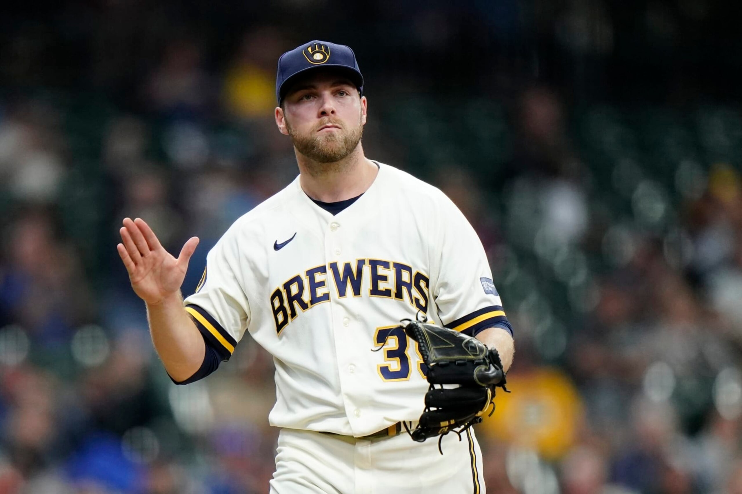 Milwaukee Brewers' Corbin Burnes reacts as he walks to the dugout during the fourth inning of a baseball game against the St. Louis Cardinals, Thursday, Sept. 28, 2023, in Milwaukee. (AP Photo/Aaron Gash)