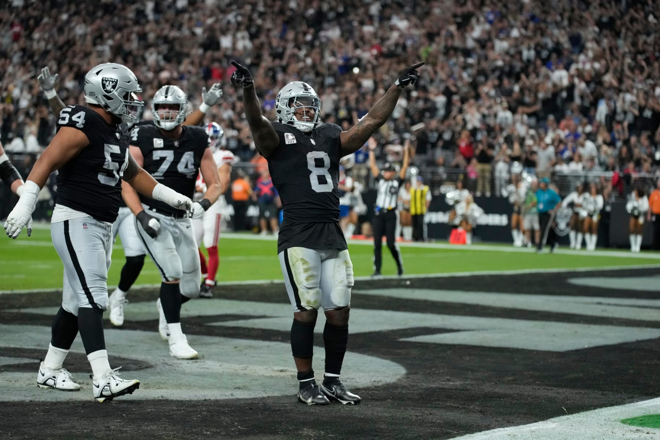 Las Vegas Raiders running back Josh Jacobs (8) celebrates after scoring a touchdown against the New York Giants during an NFL football game, Thursday, Nov. 9, 2023, in Las Vegas. (AP Photo/John Locher)