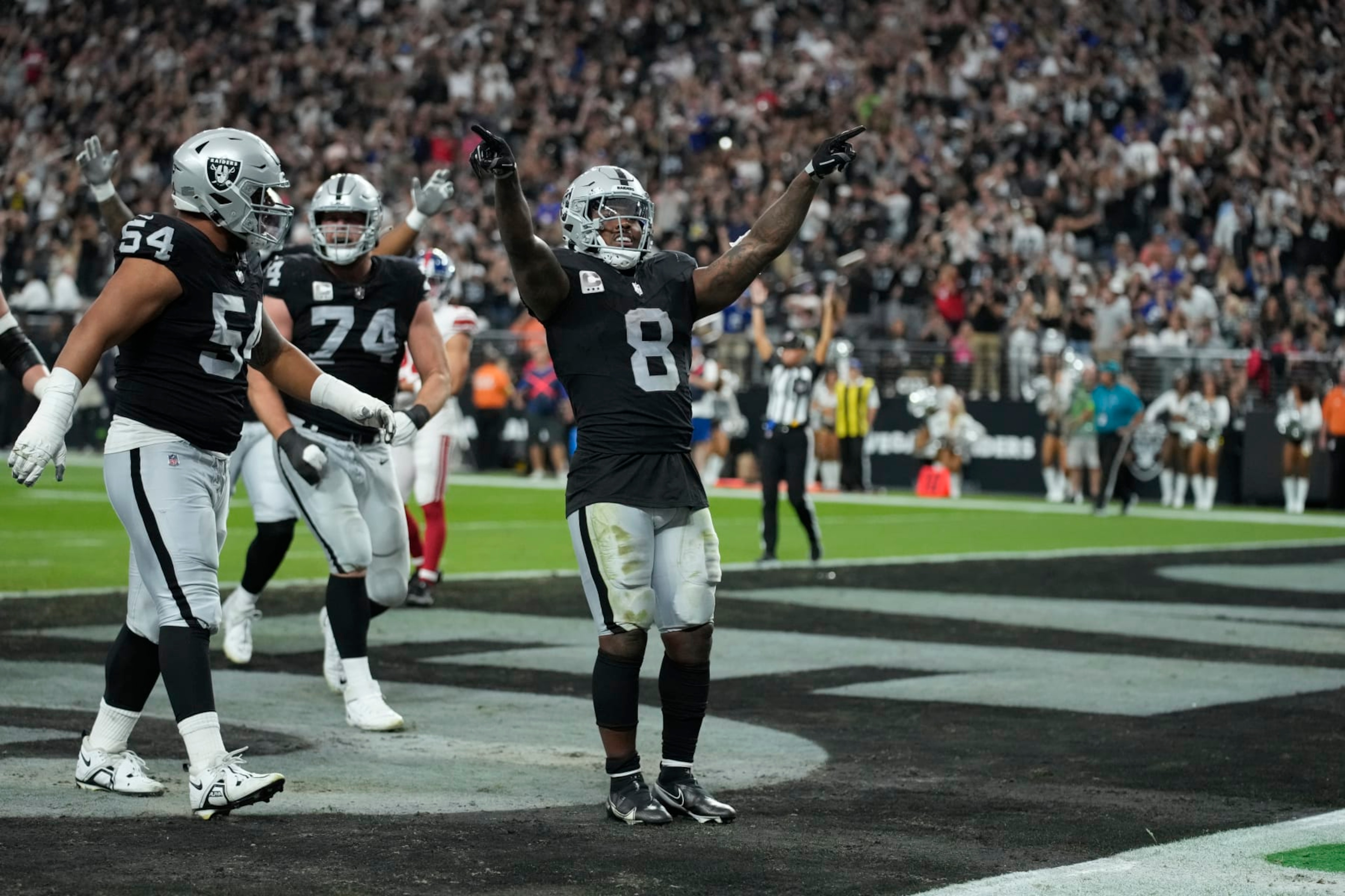 Las Vegas Raiders running back Josh Jacobs (8) celebrates after scoring a touchdown against the New York Giants during an NFL football game, Thursday, Nov. 9, 2023, in Las Vegas. (AP Photo/John Locher) Las Vegas Raiders running back Josh Jacobs (8) celebrates after scoring a touchdown against the New York Giants during an NFL football game, Thursday, Nov. 9, 2023, in Las Vegas. (AP Photo/John Locher)