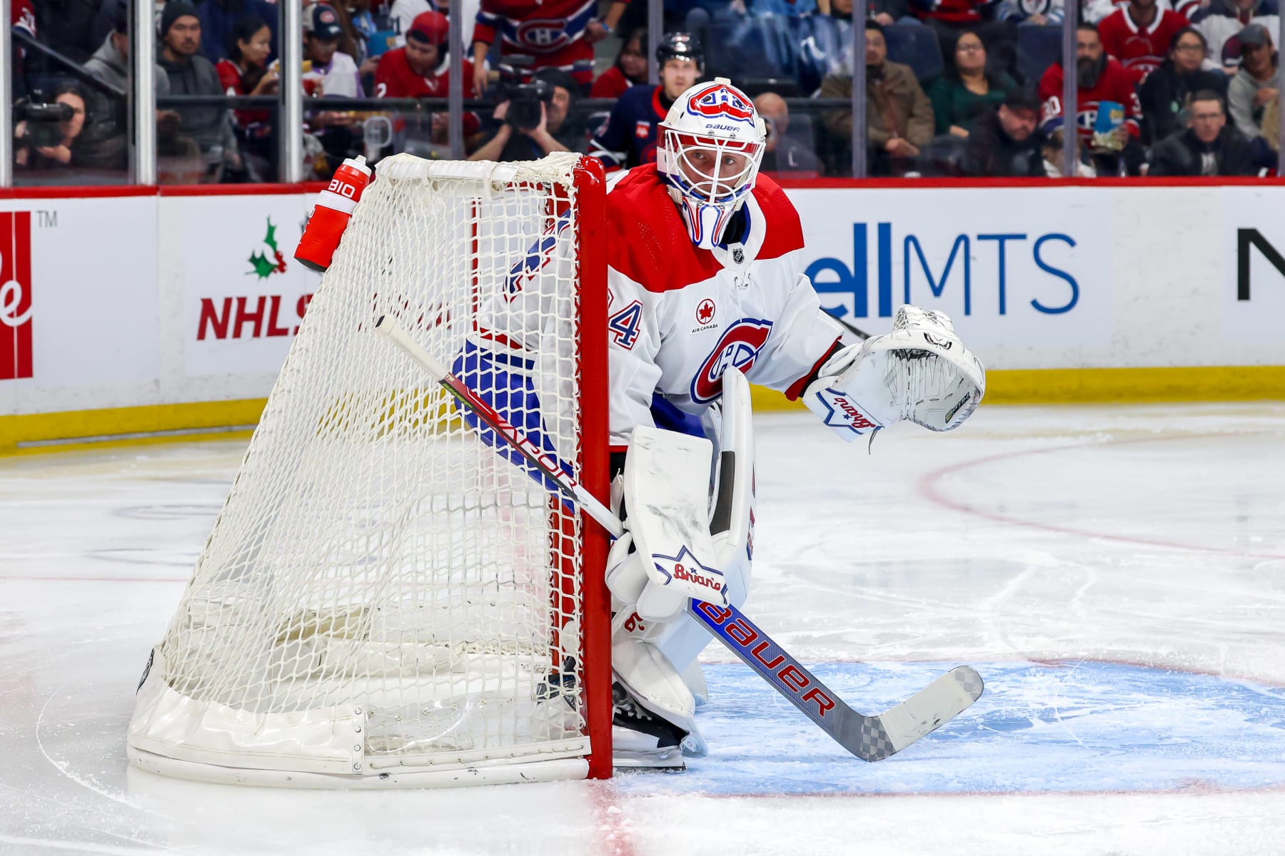 WINNIPEG, CANADA - DECEMBER 18: Goaltender Jake Allen #34 of the Montreal Canadiens keeps an eye on the play during second period action against the Winnipeg Jets at the Canada Life Centre on December 18, 2023 in Winnipeg, Manitoba, Canada. (Photo by Jonathan Kozub/NHLI via Getty Images)