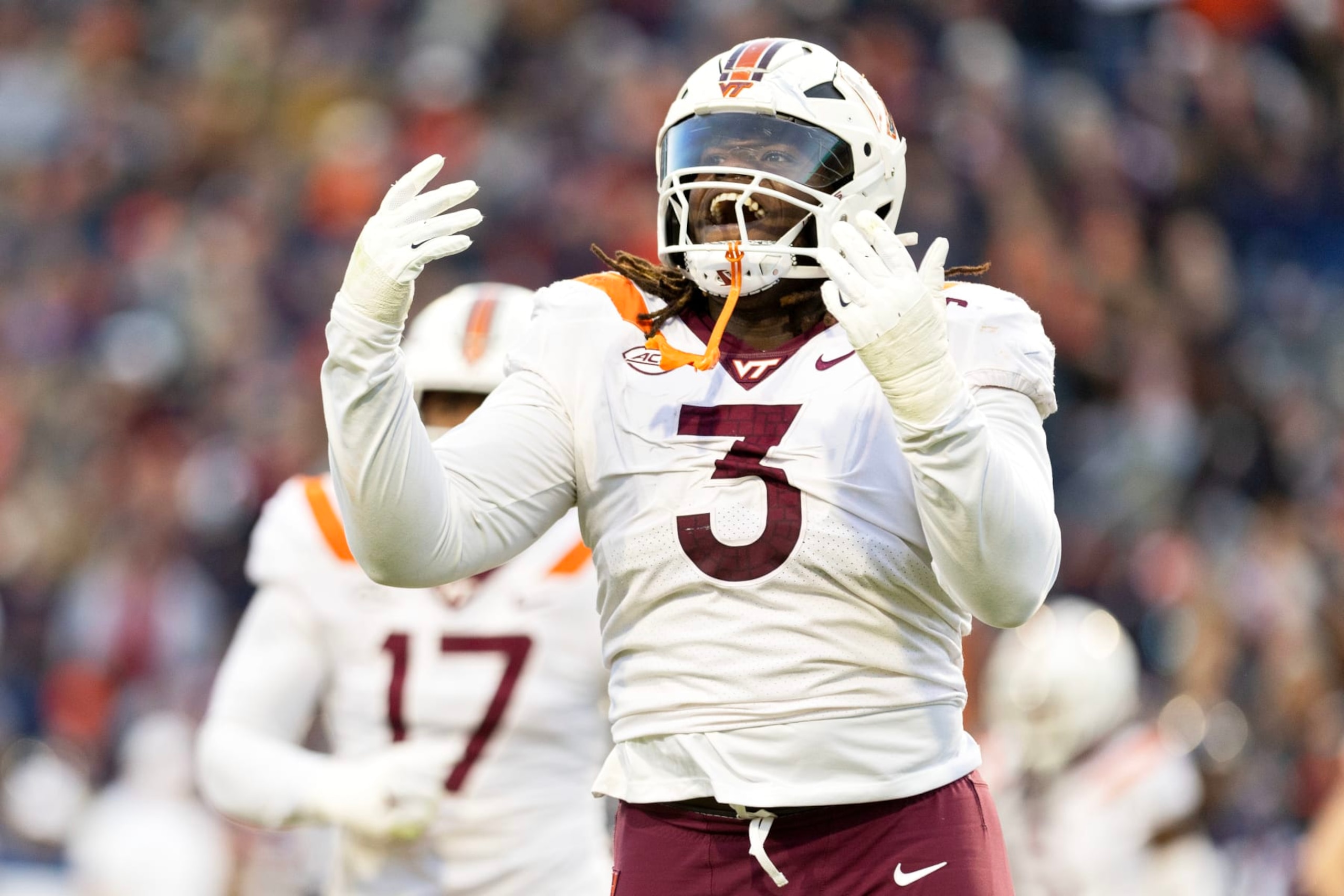 CHARLOTTESVILLE, VIRGINIA - NOVEMBER 25: Norell Pollard #3 of the Virginia Tech Hokies celebrates a defensive stop in the first half during a game against the Virginia Cavaliers at Scott Stadium on November 25, 2023 in Charlottesville, Virginia. (Photo by Ryan M. Kelly/Getty Images)