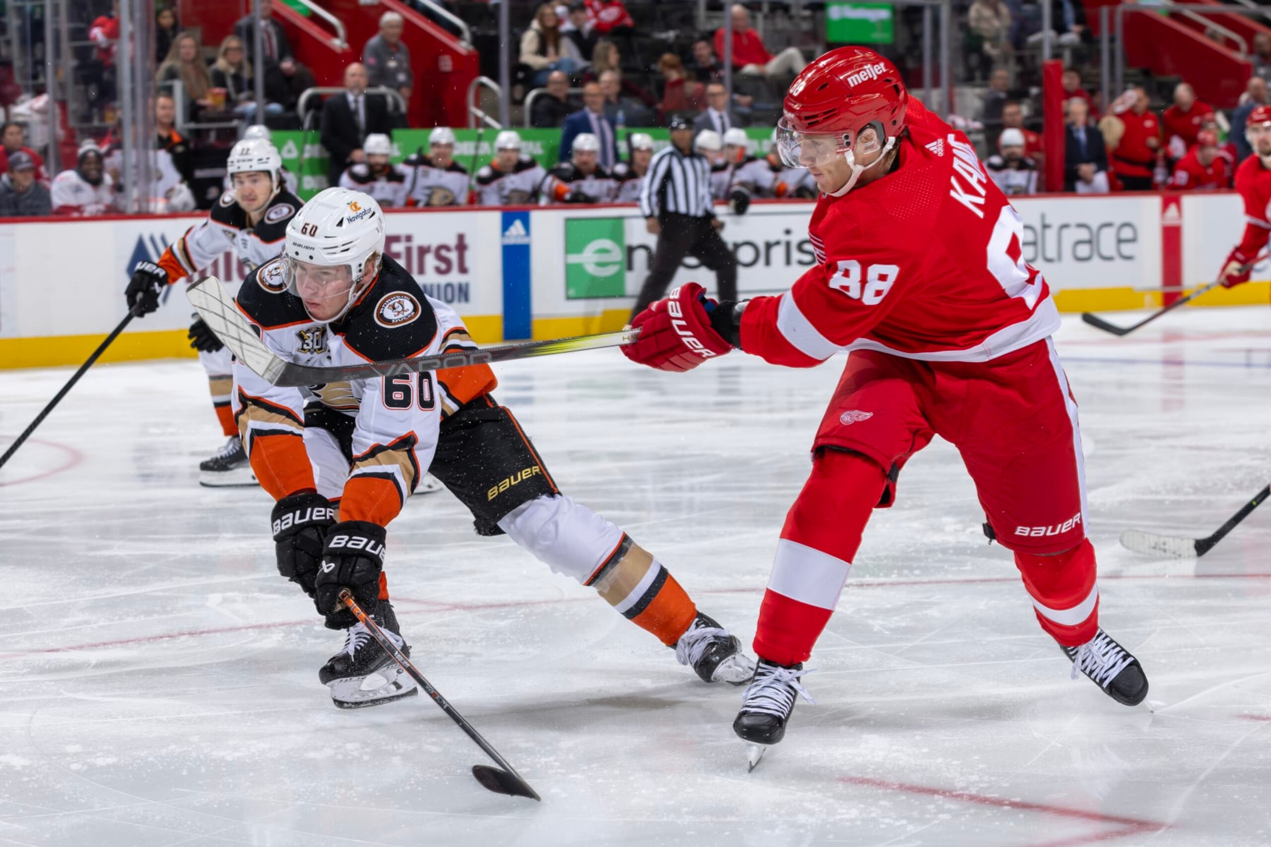 DETROIT, MI - DECEMBER 18: Patrick Kane #88 of the Detroit Red Wings shoots the puck past Jackson LaCombe #60 of the Anaheim Ducks during the third period at Little Caesars Arena on December 18, 2023 in Detroit, Michigan. Anaheim defeated Anaheim 4-3. (Photo by Dave Reginek/NHLI via Getty Images)