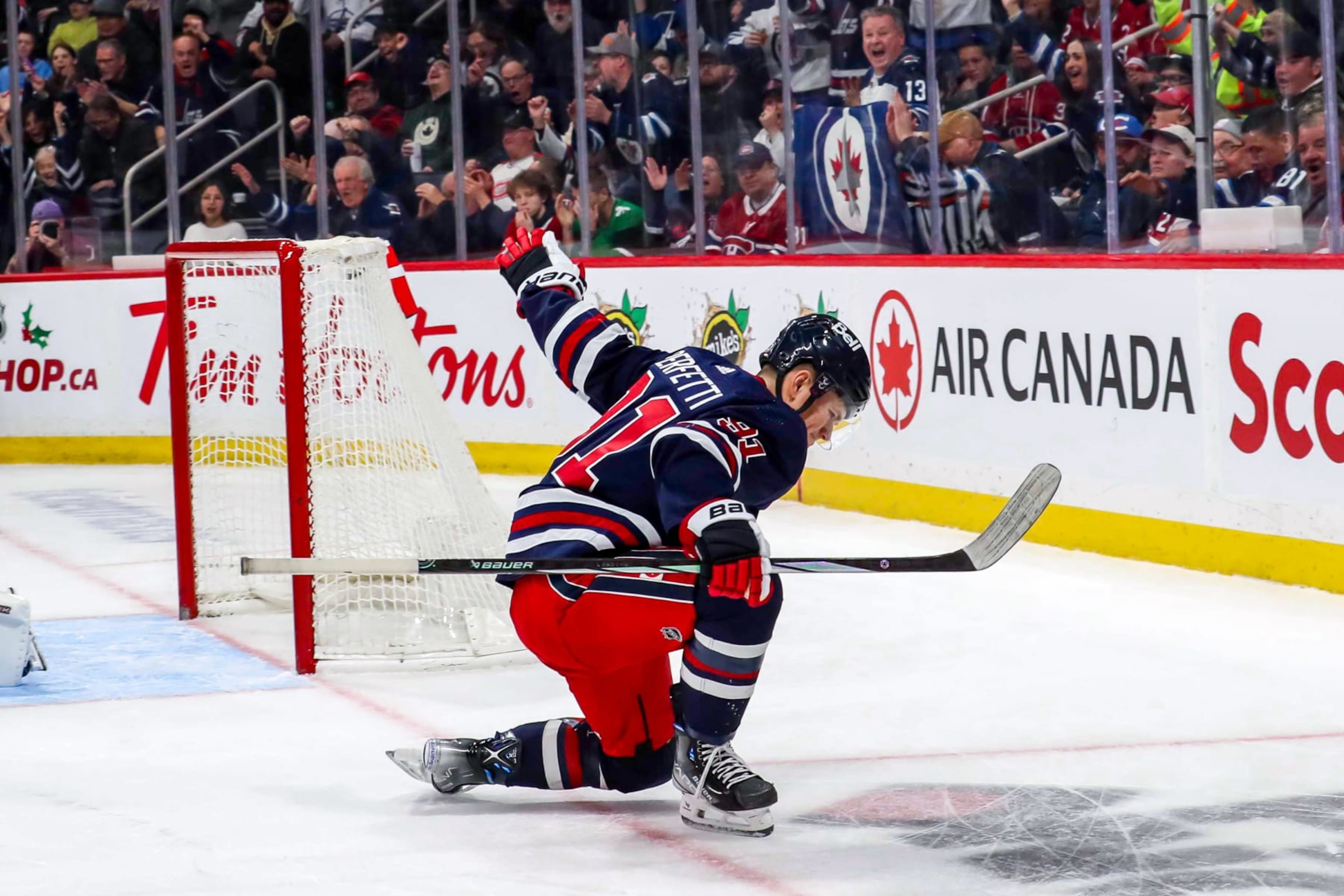 WINNIPEG, CANADA - DECEMBER 18: Cole Perfetti #91 of the Winnipeg Jets celebrates after scoring a third period goal against the Montreal Canadiens at the Canada Life Centre on December 18, 2023 in Winnipeg, Manitoba, Canada. (Photo by Darcy Finley/NHLI via Getty Images) WINNIPEG, CANADA - DECEMBER 18: Cole Perfetti #91 of the Winnipeg Jets celebrates after scoring a third period goal against the Montreal Canadiens at the Canada Life Centre on December 18, 2023 in Winnipeg, Manitoba, Canada. (Photo by Darcy Finley/NHLI via Getty Images)