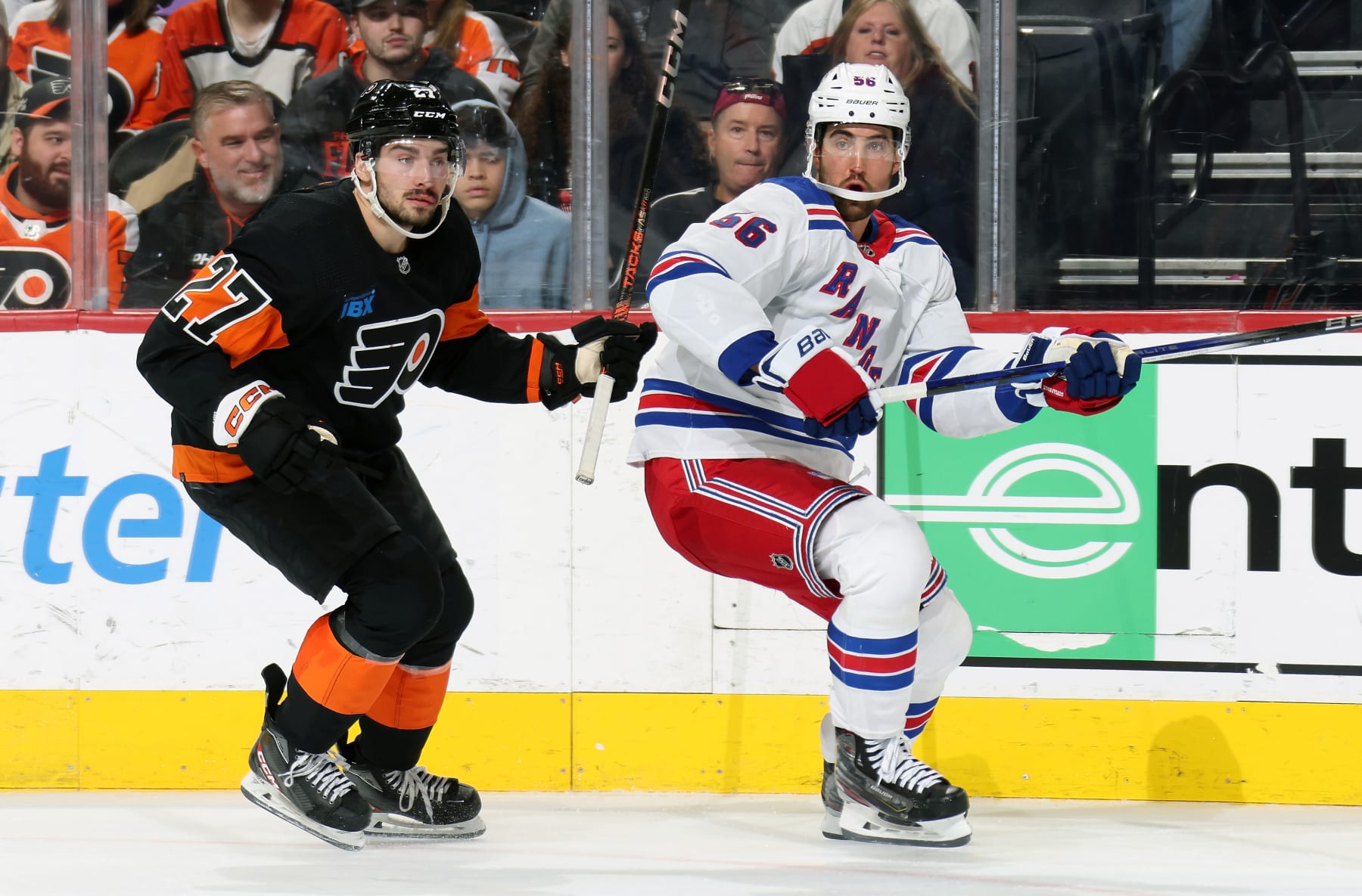 PHILADELPHIA, PENNSYLVANIA - NOVEMBER 24:  Noah Cates #27 of the Philadelphia Flyers skates against Erik Gustafsson #56 of the New York Rangers at the Wells Fargo Center on November 24, 2023 in Philadelphia, Pennsylvania.  (Photo by Len Redkoles/NHLI via Getty Images)