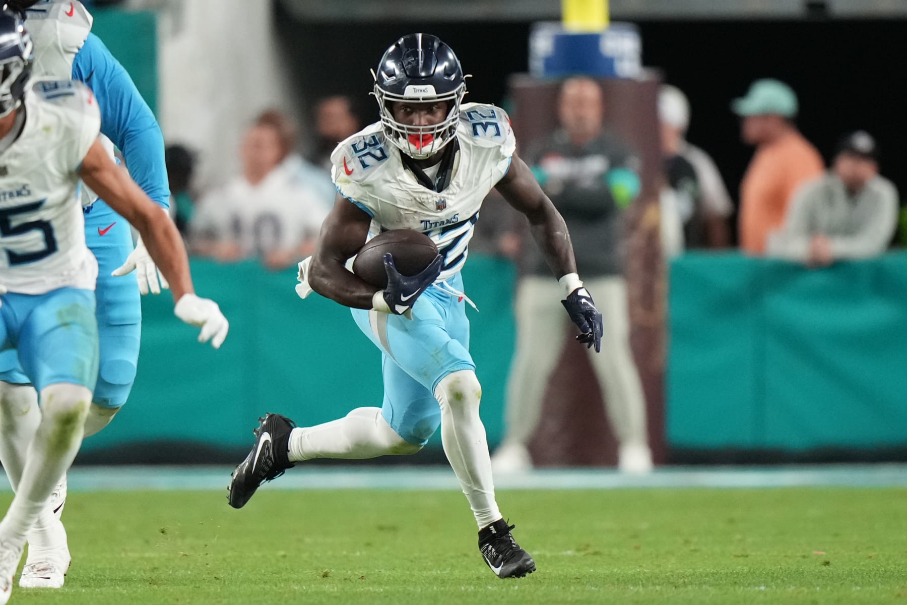 MIAMI GARDENS, FL - DECEMBER 11: Tennessee Titans running back Tyjae Spears (32) rushes with the ball during the game between the Tennessee Titans and Miami Dolphins on Monday, Dec. 11, 2023 at Hard Rock Stadium, Miami Gardens, Fla. (Photo by Peter Joneleit/Icon Sportswire via Getty Images)