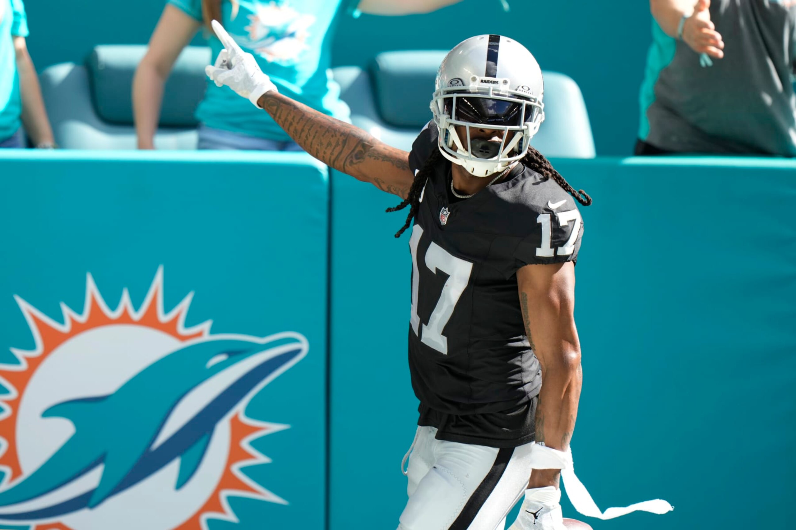 Las Vegas Raiders wide receiver Davante Adams (17) gestures after scoring a touchdown during the first half of an NFL football game against the Miami Dolphins, Sunday, Nov. 19, 2023, in Miami Gardens, Fla. (AP Photo/Wilfredo Lee)