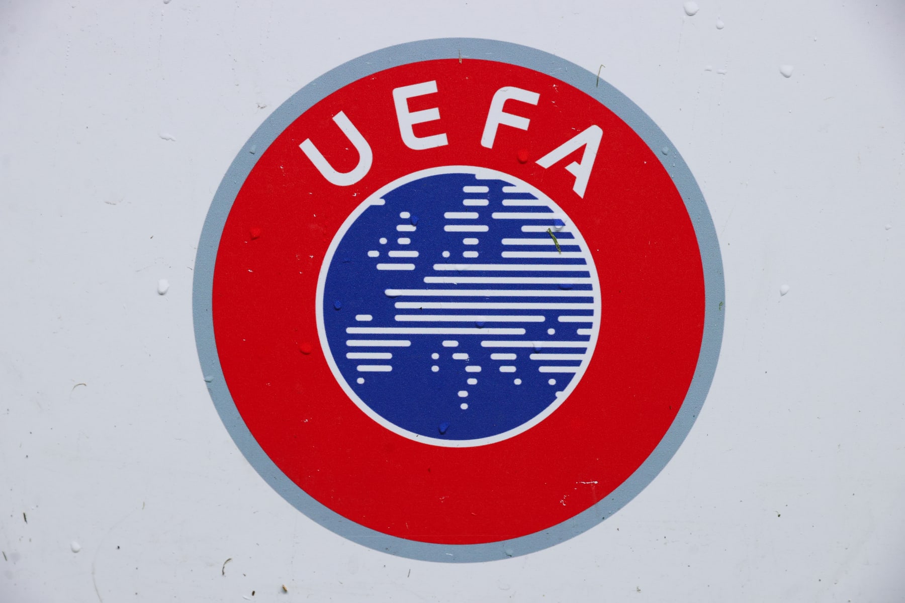 NEWCASTLE UPON TYNE, ENGLAND - DECEMBER 13: The UEFA 
logo is seen prior to the UEFA Champions League match between Newcastle United FC and AC Milan at St. James Park on December 13, 2023 in Newcastle upon Tyne, England. (Photo by James Gill - Danehouse/Getty Images)