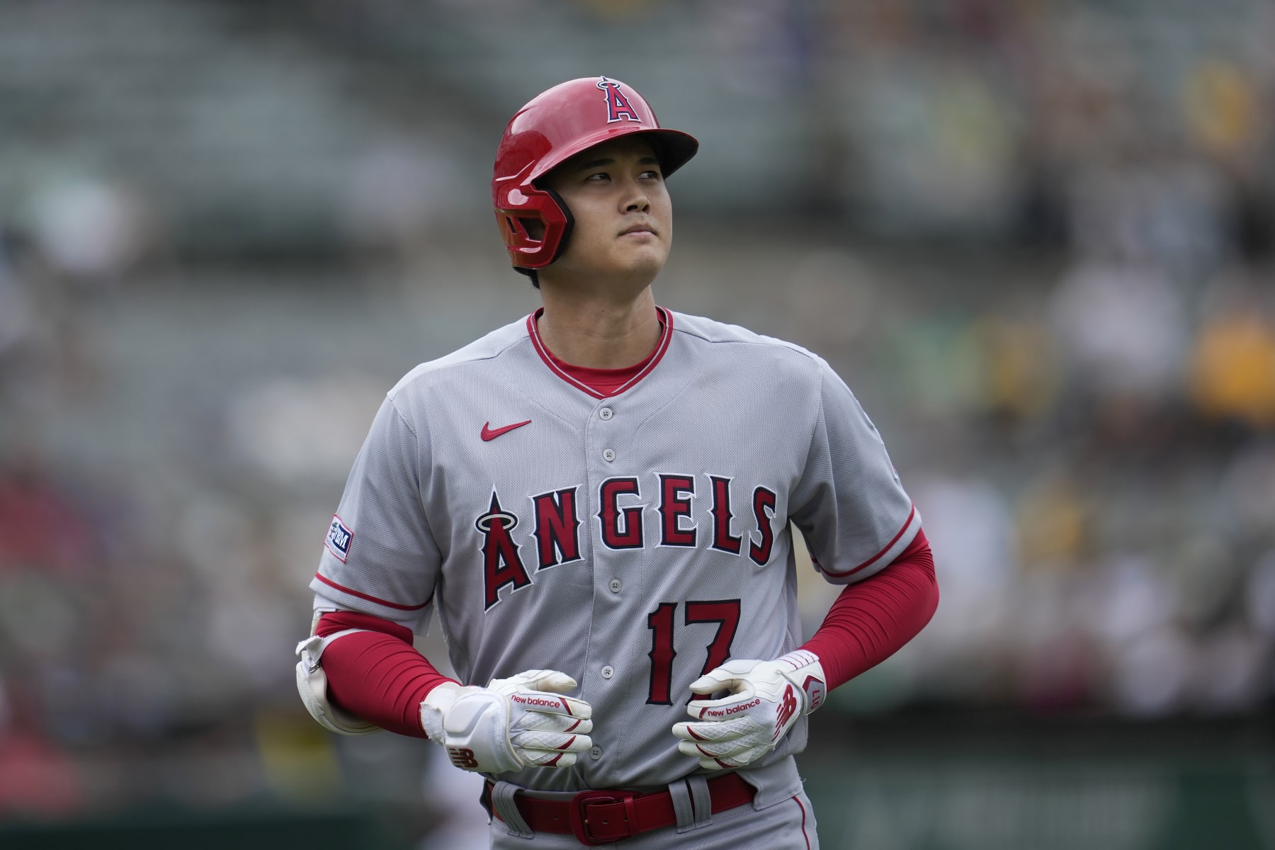 Los Angeles Angels' Shohei Ohtani jogs to the dugout after popping out during the seventh inning of a baseball game against the Oakland Athletics in Oakland, Calif., Saturday, Sept. 2, 2023. (AP Photo/Jeff Chiu)