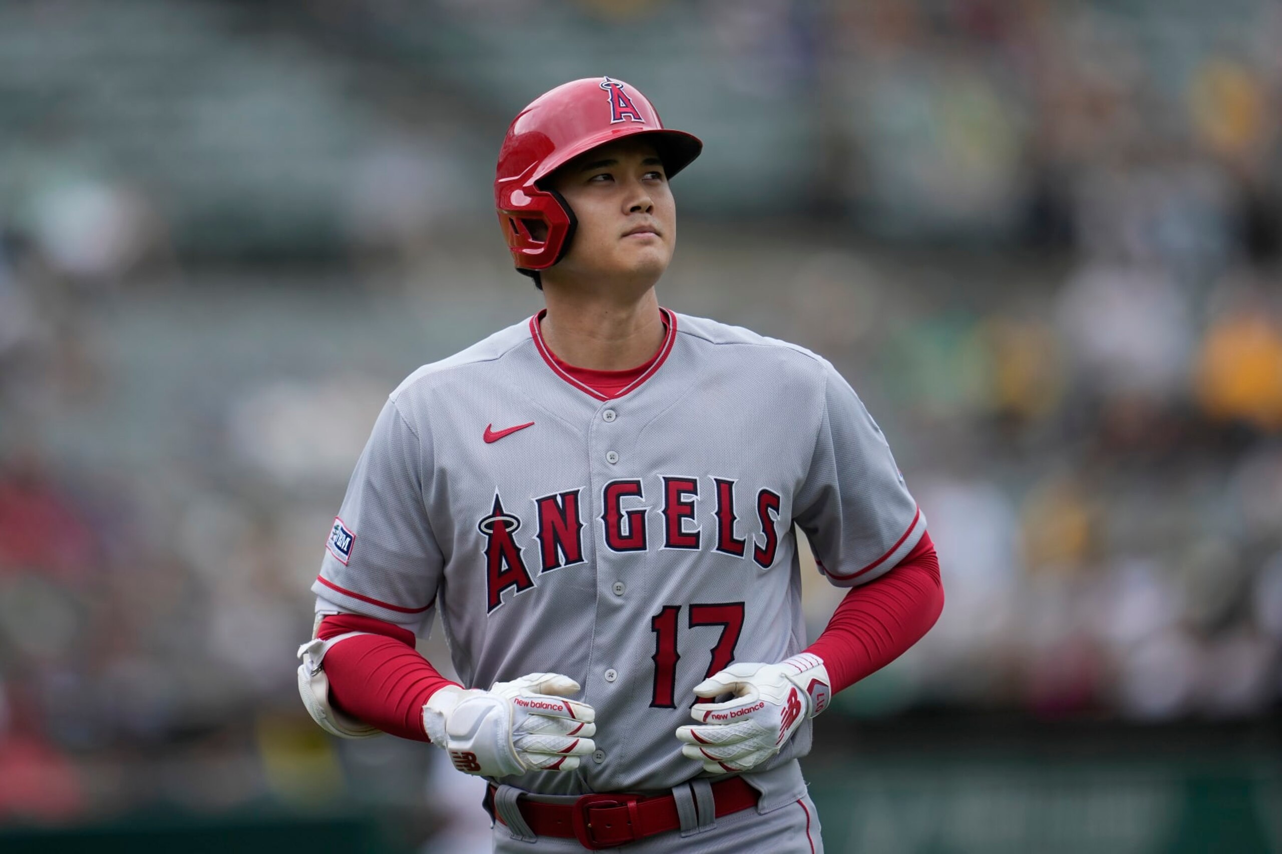 Los Angeles Angels' Shohei Ohtani jogs to the dugout after popping out during the seventh inning of a baseball game against the Oakland Athletics in Oakland, Calif., Saturday, Sept. 2, 2023. (AP Photo/Jeff Chiu)