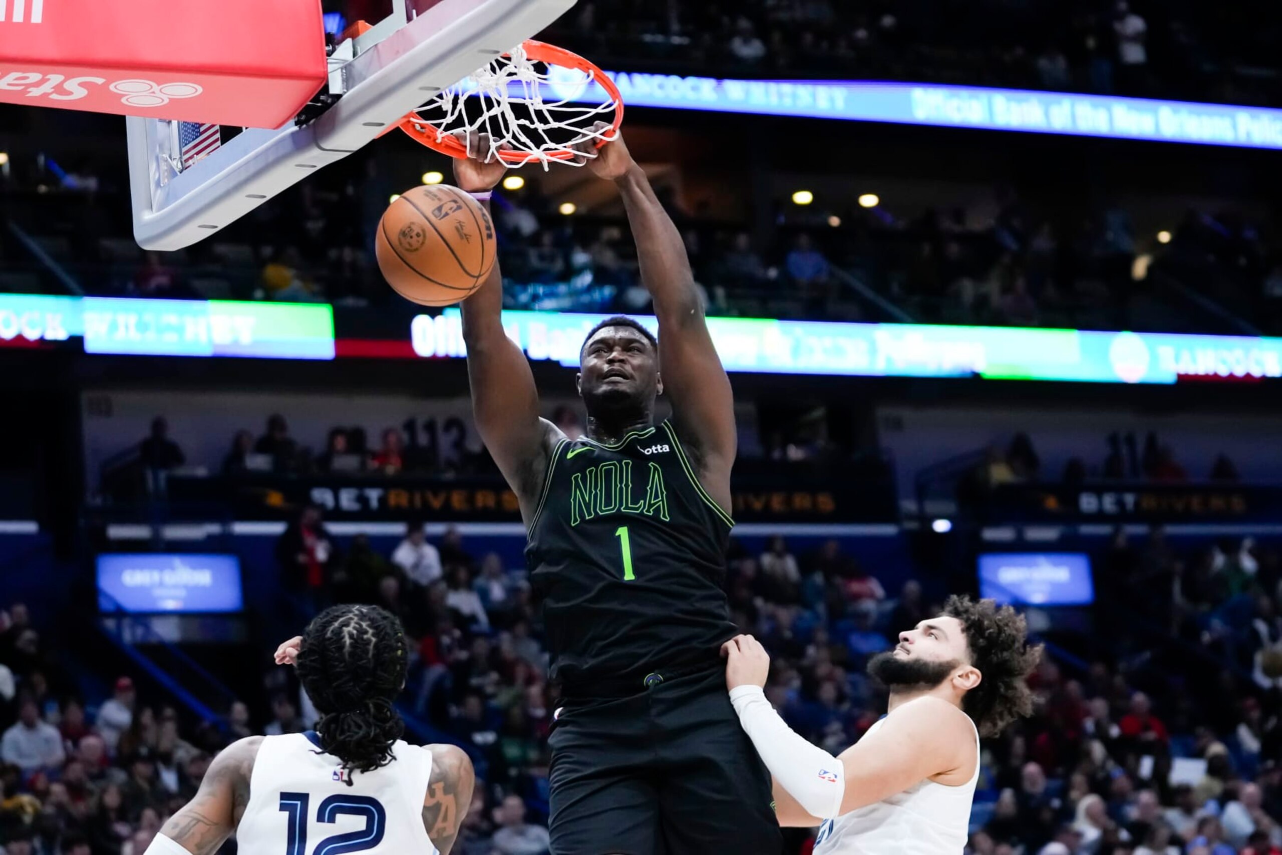New Orleans Pelicans forward Zion Williamson (1) slam dunks in the second half of an NBA basketball game against the Memphis Grizzlies in New Orleans, Tuesday, Dec. 19, 2023. The Grizzlies won 115-113. (AP Photo/Gerald Herbert) New Orleans Pelicans forward Zion Williamson (1) slam dunks in the second half of an NBA basketball game against the Memphis Grizzlies in New Orleans, Tuesday, Dec. 19, 2023. The Grizzlies won 115-113. (AP Photo/Gerald Herbert)