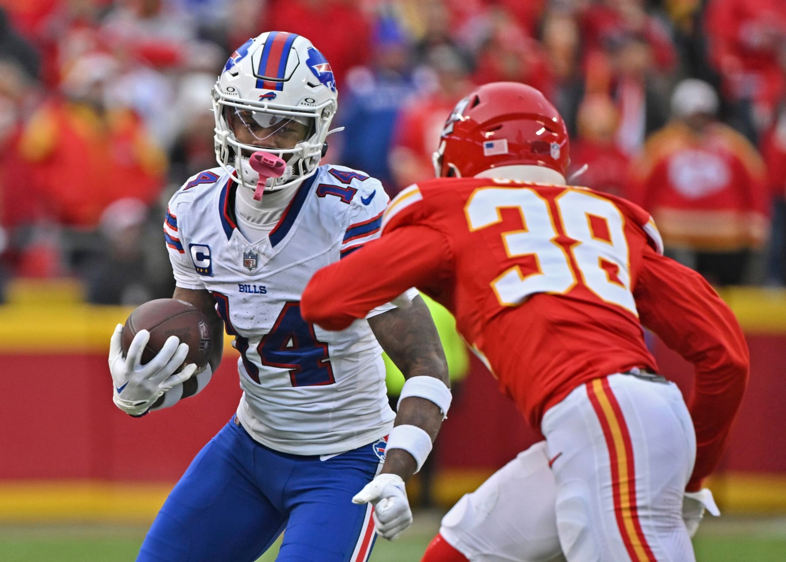 Buffalo Bills wide receiver Stefon Diggs (14) runs up field with the ball against Kansas City Chiefs cornerback L'Jarius Sneed (38) during an NFL football game against Sunday, Dec. 10, 2023, in Kansas City, Mo. (AP Photo/Peter Aiken)