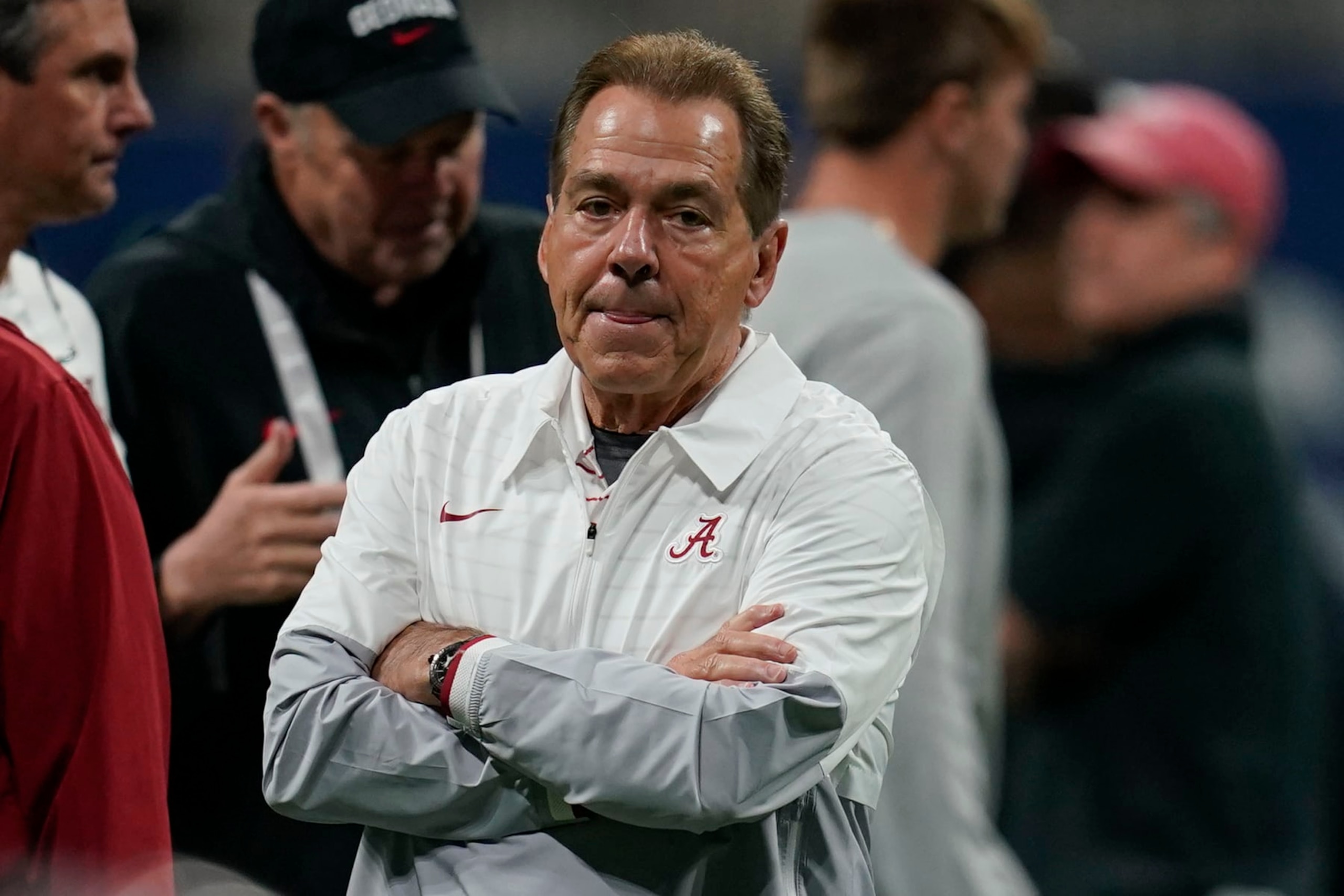 Alabama head coach Nick Saban runs onto the field before the Southeastern Conference championship NCAA college football game against Georgia in Atlanta, Saturday, Dec. 2, 2023. (AP Photo/Mike Stewart)