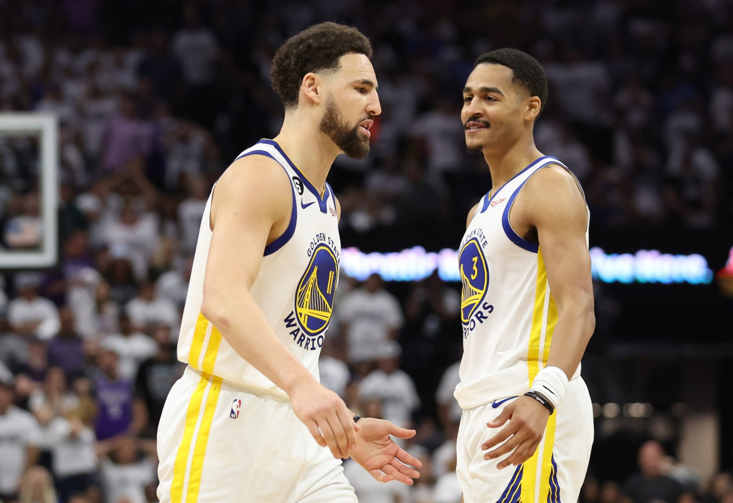SACRAMENTO, CALIFORNIA - APRIL 30: Klay Thompson #11 of the Golden State Warriors reacts with Jordan Poole #3 during the third quarter in game seven of the Western Conference First Round Playoffs against the Sacramento Kings at Golden 1 Center on April 30, 2023 in Sacramento, California. NOTE TO USER: User expressly acknowledges and agrees that, by downloading and or using this photograph, User is consenting to the terms and conditions of the Getty Images License Agreement. (Photo by Ezra Shaw/Getty Images)