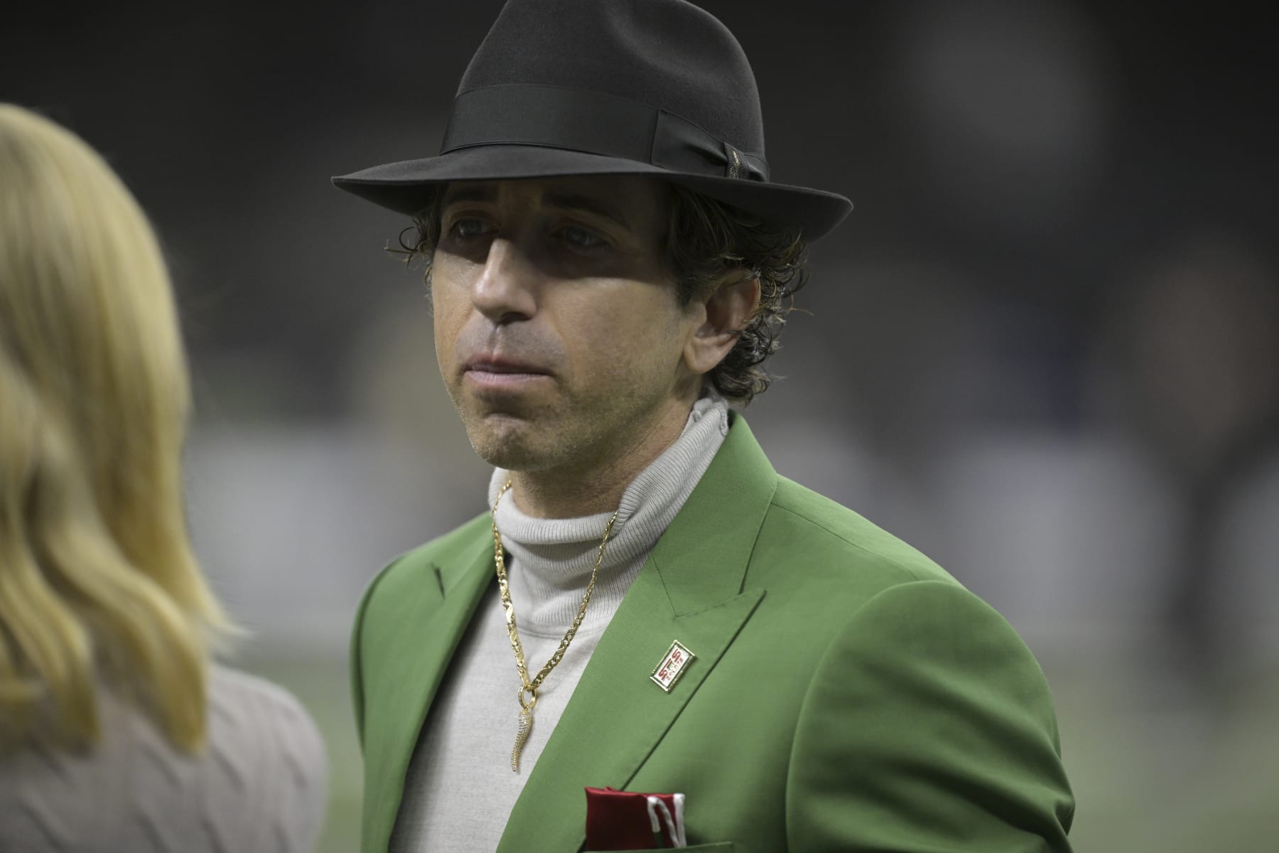 Sports agent Sean Stellato, who represents New York Giants quarterback Tommy DeVito, wears a green outfit from the Italian American Sports Hall of Fame before an NFL football game against the New Orleans Saints in New Orleans, Sunday, Dec. 17, 2023. (AP Photo/Matthew Hinton)