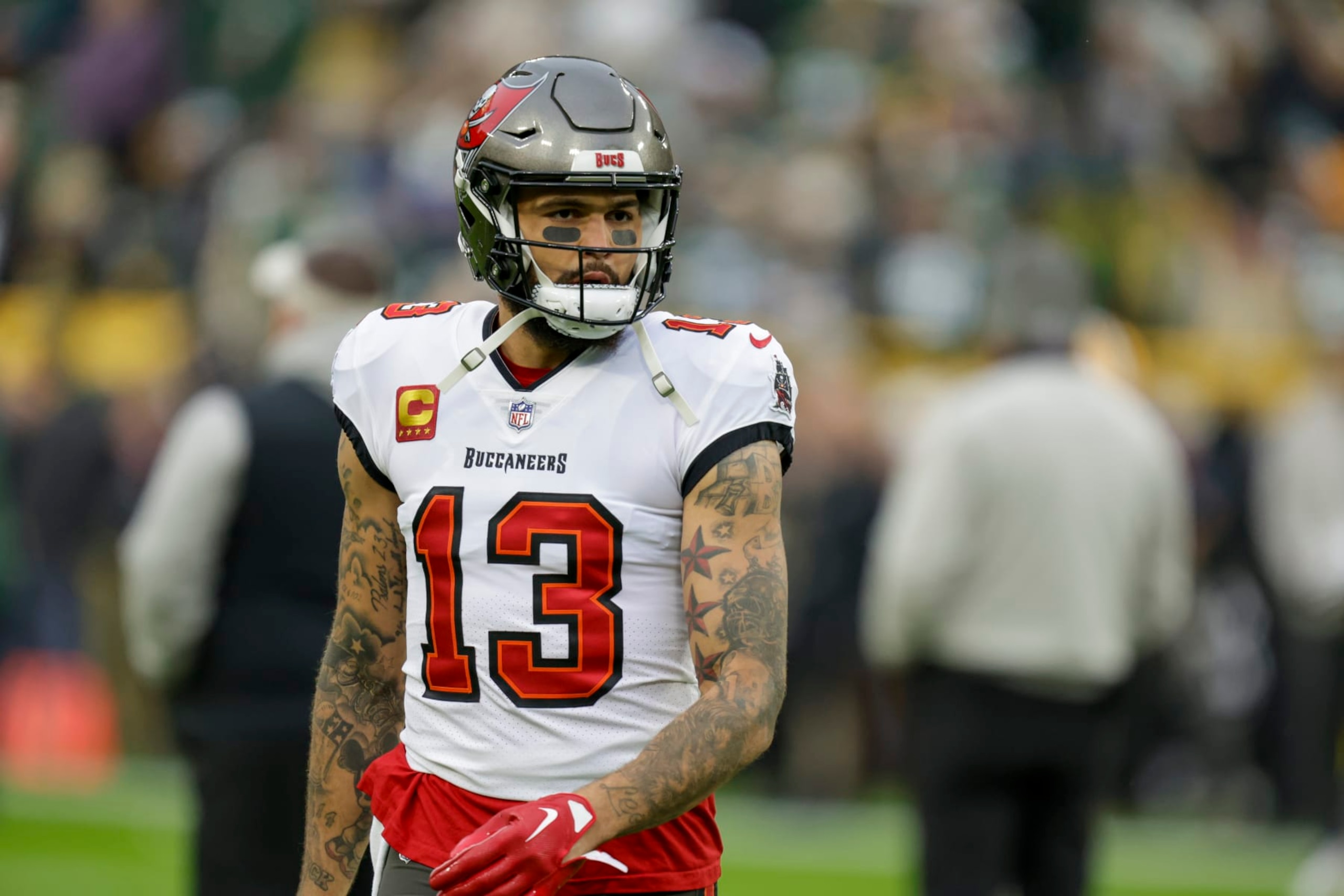 Tampa Bay Buccaneers wide receiver Mike Evans (13) warms up before an NFL football game between the Green Bay Packers and Tampa Bay Buccaneers Sunday, Dec. 17, 2023, in Green Bay, Wis. (AP Photo/Matt Ludtke) Tampa Bay Buccaneers wide receiver Mike Evans (13) warms up before an NFL football game between the Green Bay Packers and Tampa Bay Buccaneers Sunday, Dec. 17, 2023, in Green Bay, Wis. (AP Photo/Matt Ludtke)