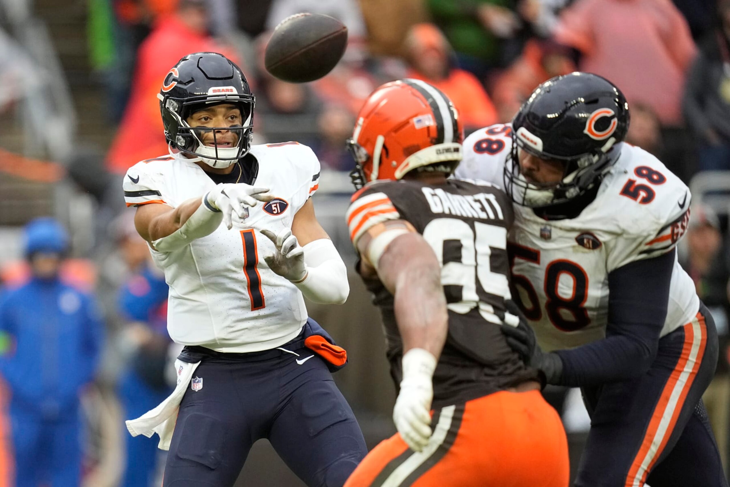 Chicago Bears quarterback Justin Fields (1) throws under pressure from Cleveland Browns defensive end Myles Garrett (95) in the first half of an NFL football game, Sunday, Dec. 17, 2023, in Cleveland. (AP Photo/Sue Ogrocki) Chicago Bears quarterback Justin Fields (1) throws under pressure from Cleveland Browns defensive end Myles Garrett (95) in the first half of an NFL football game, Sunday, Dec. 17, 2023, in Cleveland. (AP Photo/Sue Ogrocki)