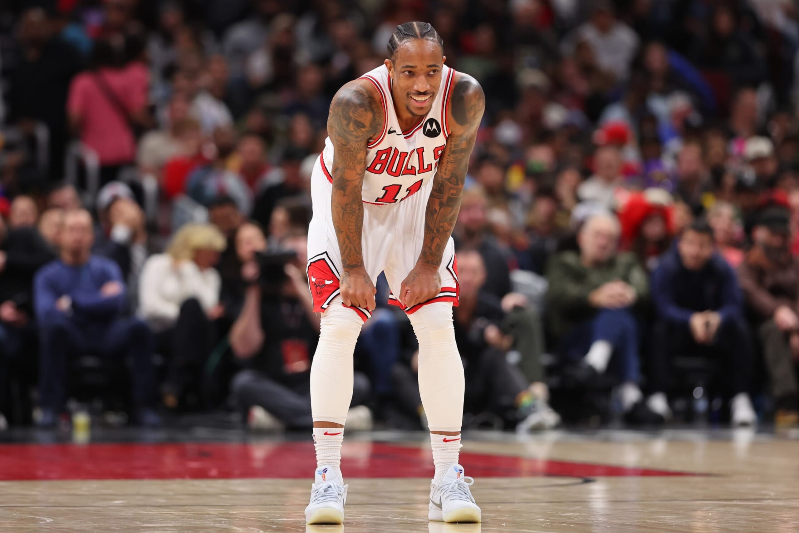 CHICAGO, ILLINOIS - DECEMBER 20: DeMar DeRozan #11 of the Chicago Bulls laughs against the Los Angeles Lakers during the second half at the United Center on December 20, 2023 in Chicago, Illinois. NOTE TO USER: User expressly acknowledges and agrees that, by downloading and or using this photograph, User is consenting to the terms and conditions of the Getty Images License Agreement.  (Photo by Michael Reaves/Getty Images)