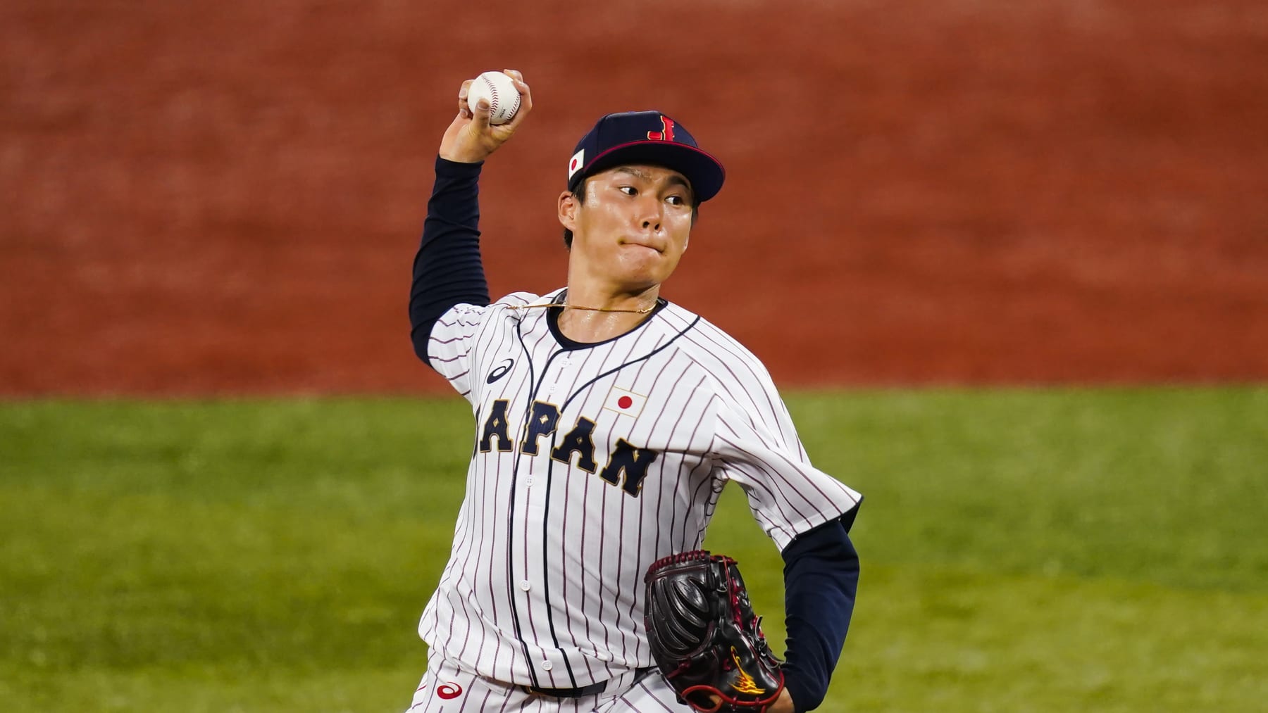 Japan's Yoshinobu Yamamoto pitches during the first inning of a semi-final baseball game against South Korea at the 2020 Summer Olympics, Wednesday, Aug. 4, 2021, in Yokohama, Japan. (AP Photo/Matt Slocum)