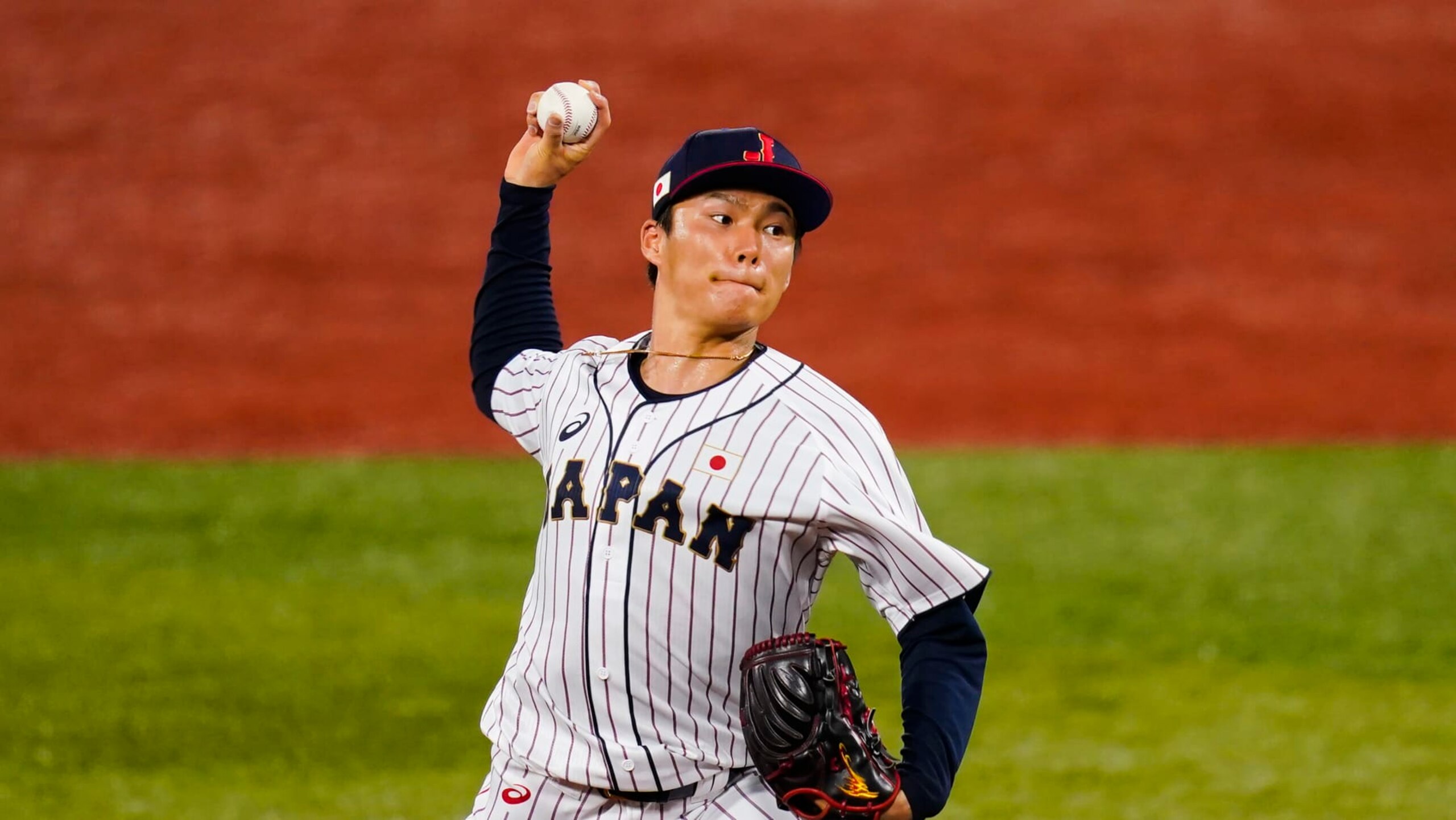 Japan's Yoshinobu Yamamoto pitches during the first inning of a semi-final baseball game against South Korea at the 2020 Summer Olympics, Wednesday, Aug. 4, 2021, in Yokohama, Japan. (AP Photo/Matt Slocum)