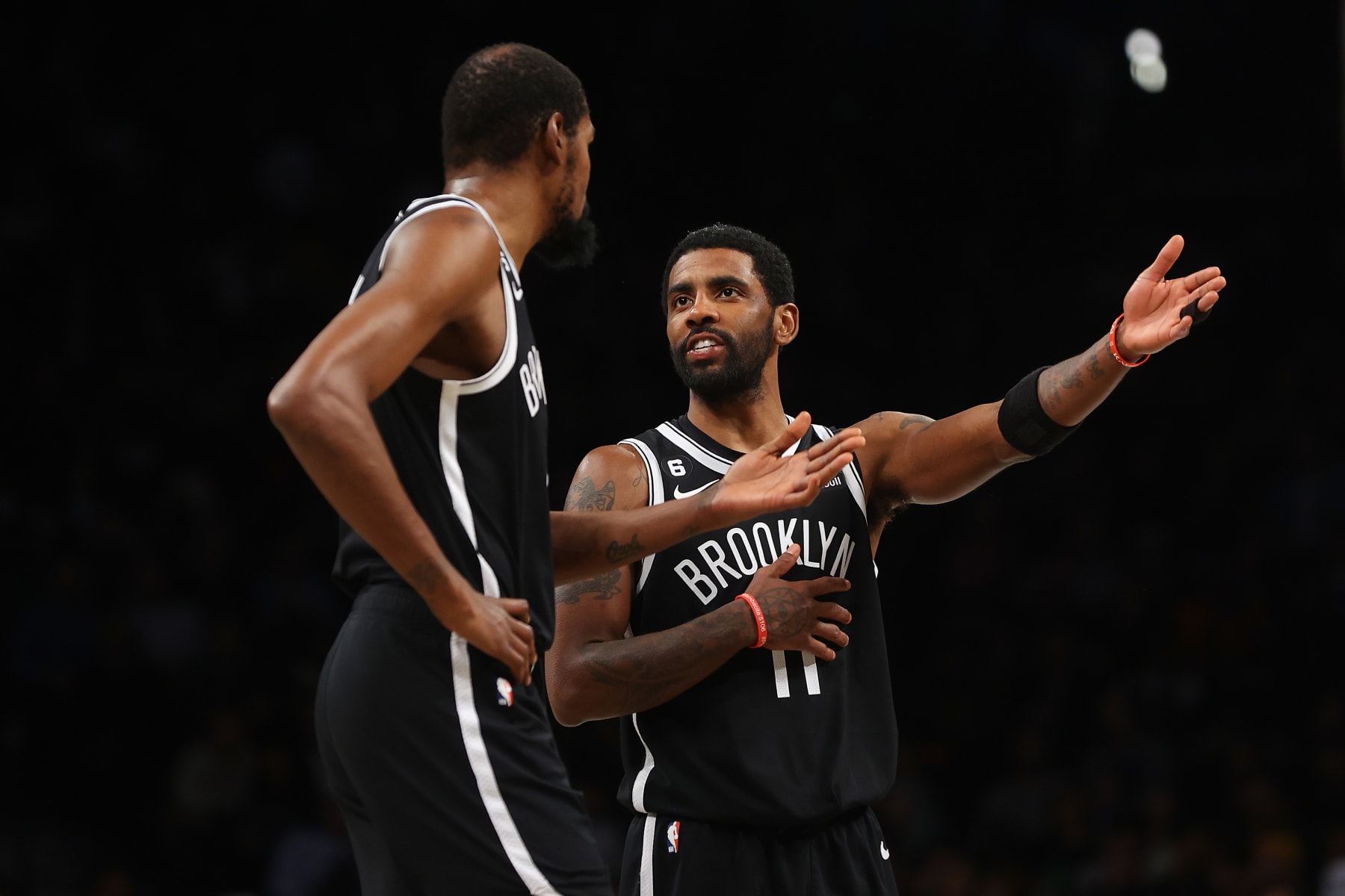NEW YORK, NEW YORK - NOVEMBER 28: Kevin Durant #7 and Kyrie Irving #11 of the Brooklyn Nets in action against the Orlando Magic at Barclays Center on November 28, 2022 in New York City. NOTE TO USER: User expressly acknowledges and agrees that, by downloading and or using this Photograph, user is consenting to the terms and conditions of the Getty Images License Agreement. Brooklyn Nets defeated the Orlando Magic 109-102. (Photo by Mike Stobe/Getty Images)